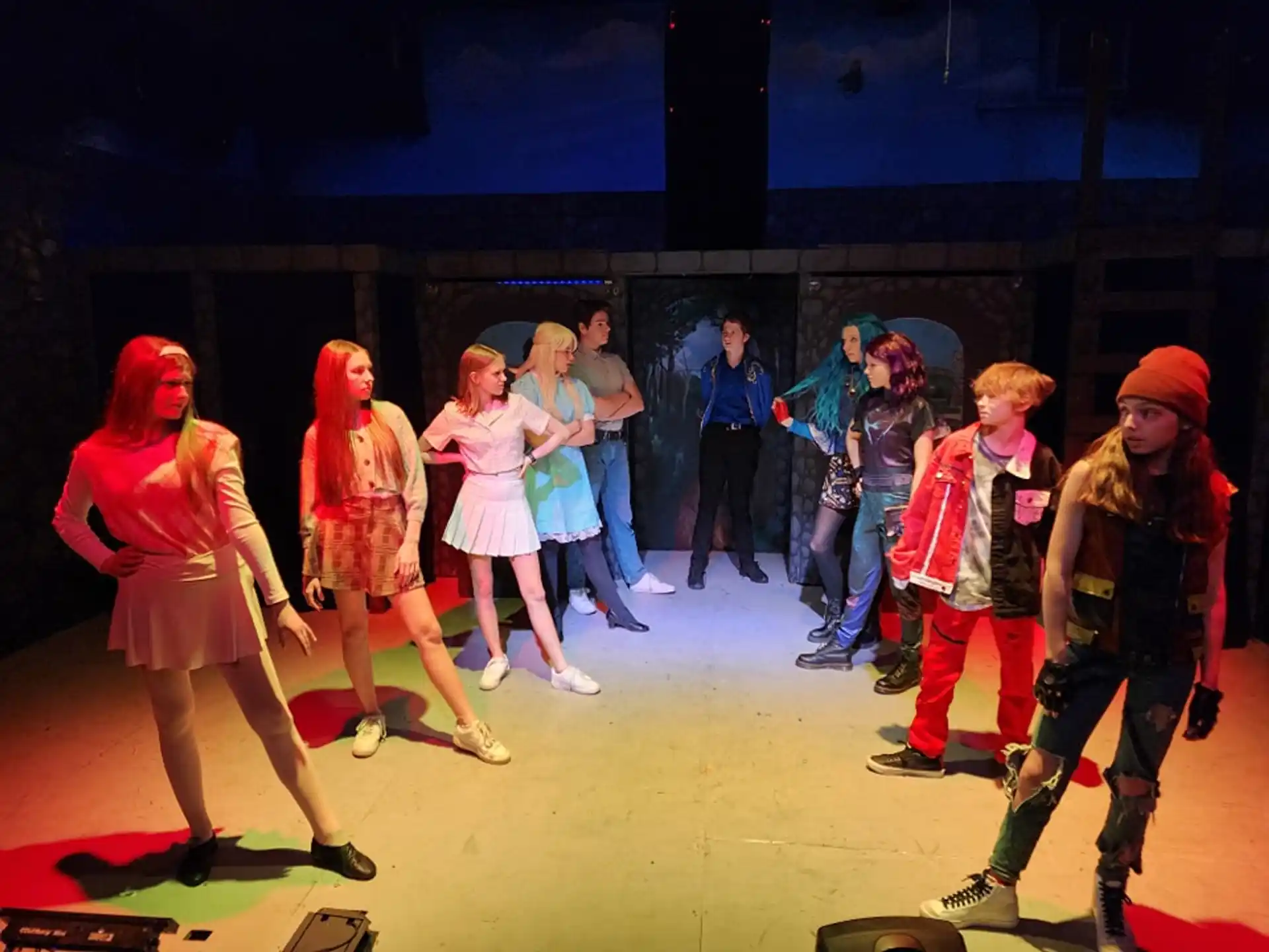 a group of people dancing on a stage