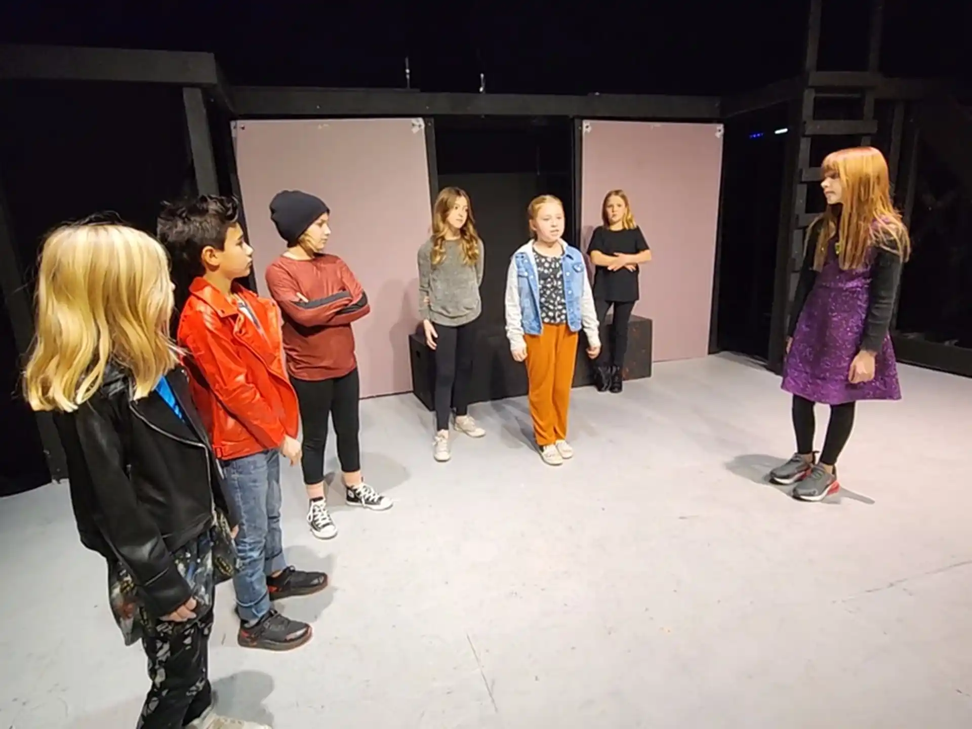 a group of people standing in a room
