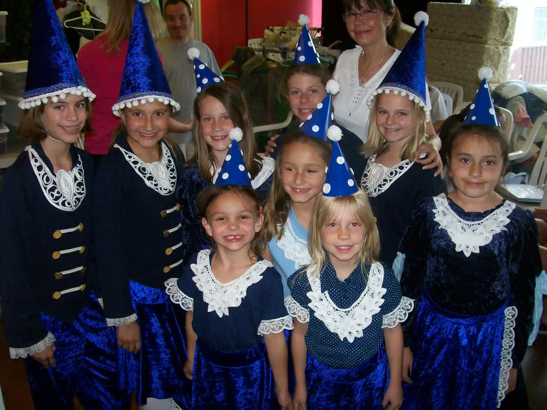 a group of people wearing party hats