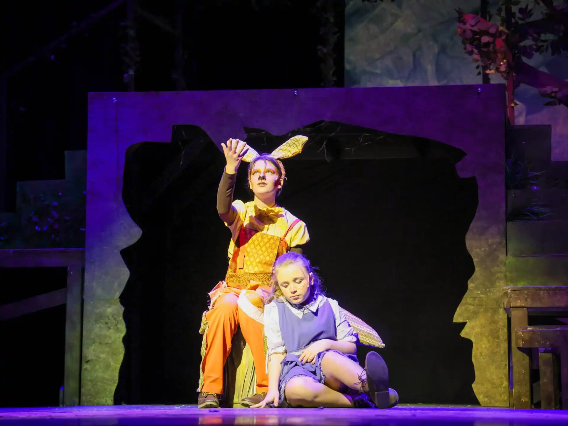 a person and a child on a stage