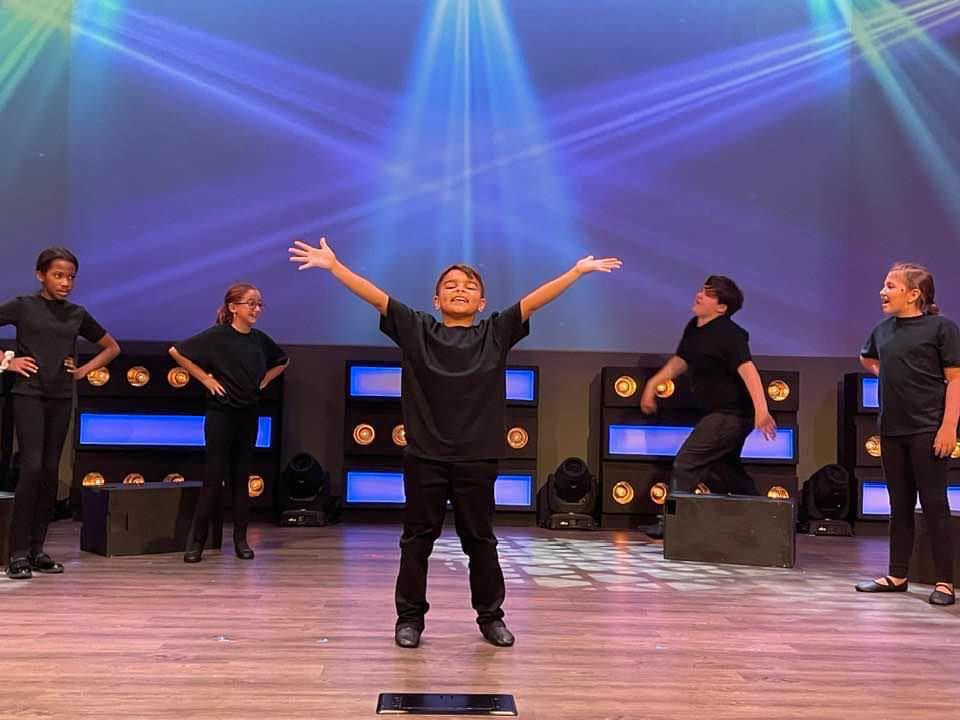 a group of people on a stage