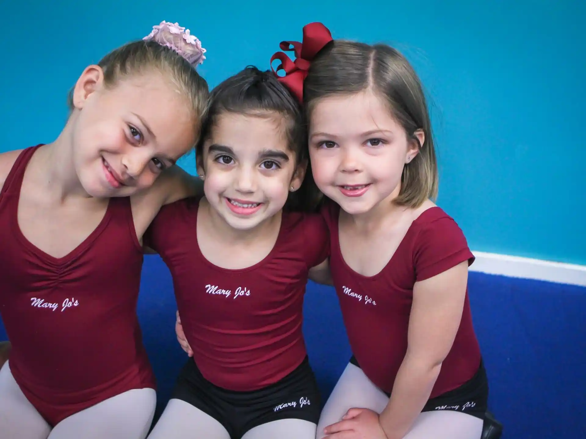 a group of girls posing for a picture