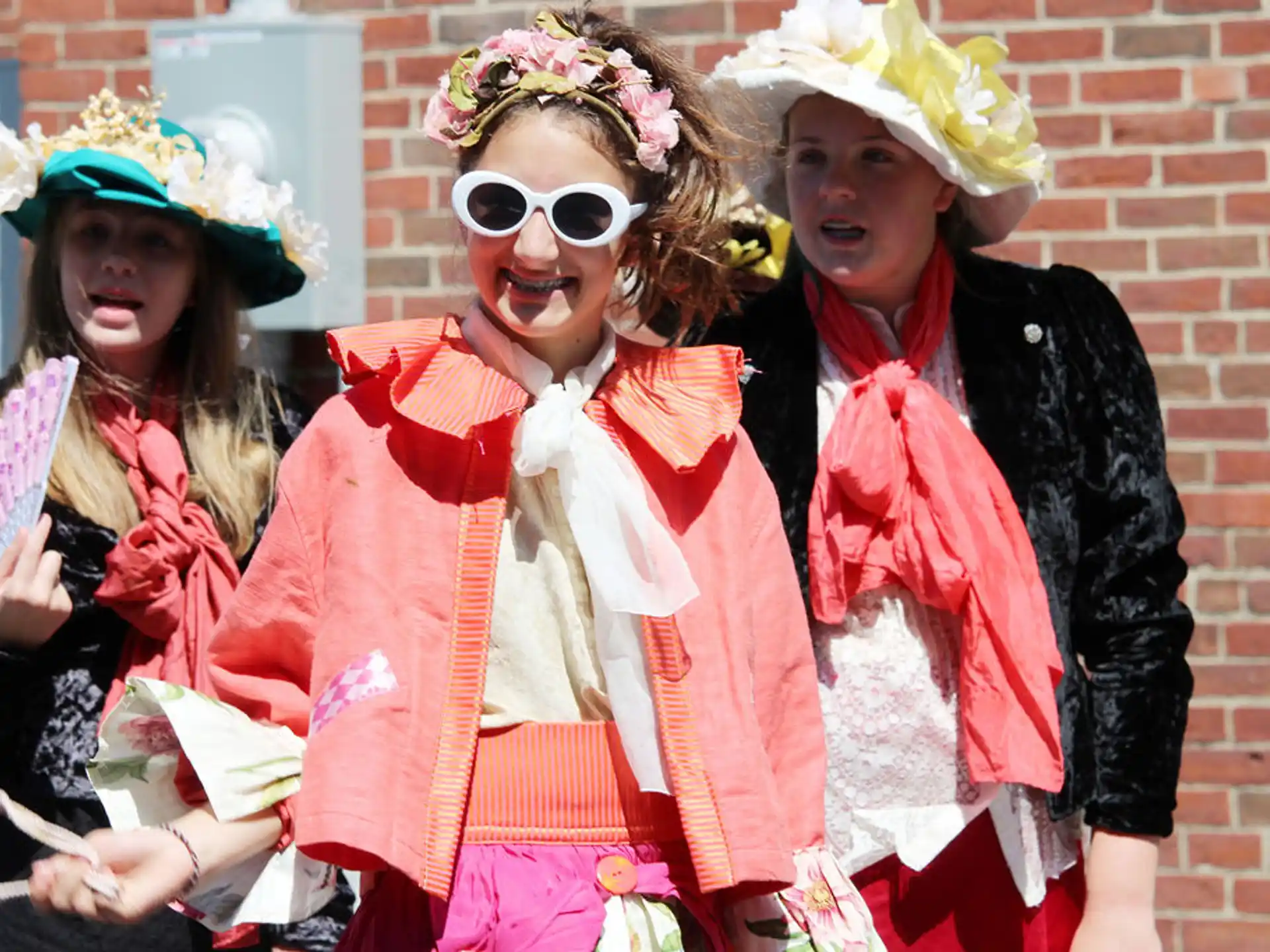 a group of women wearing clothing