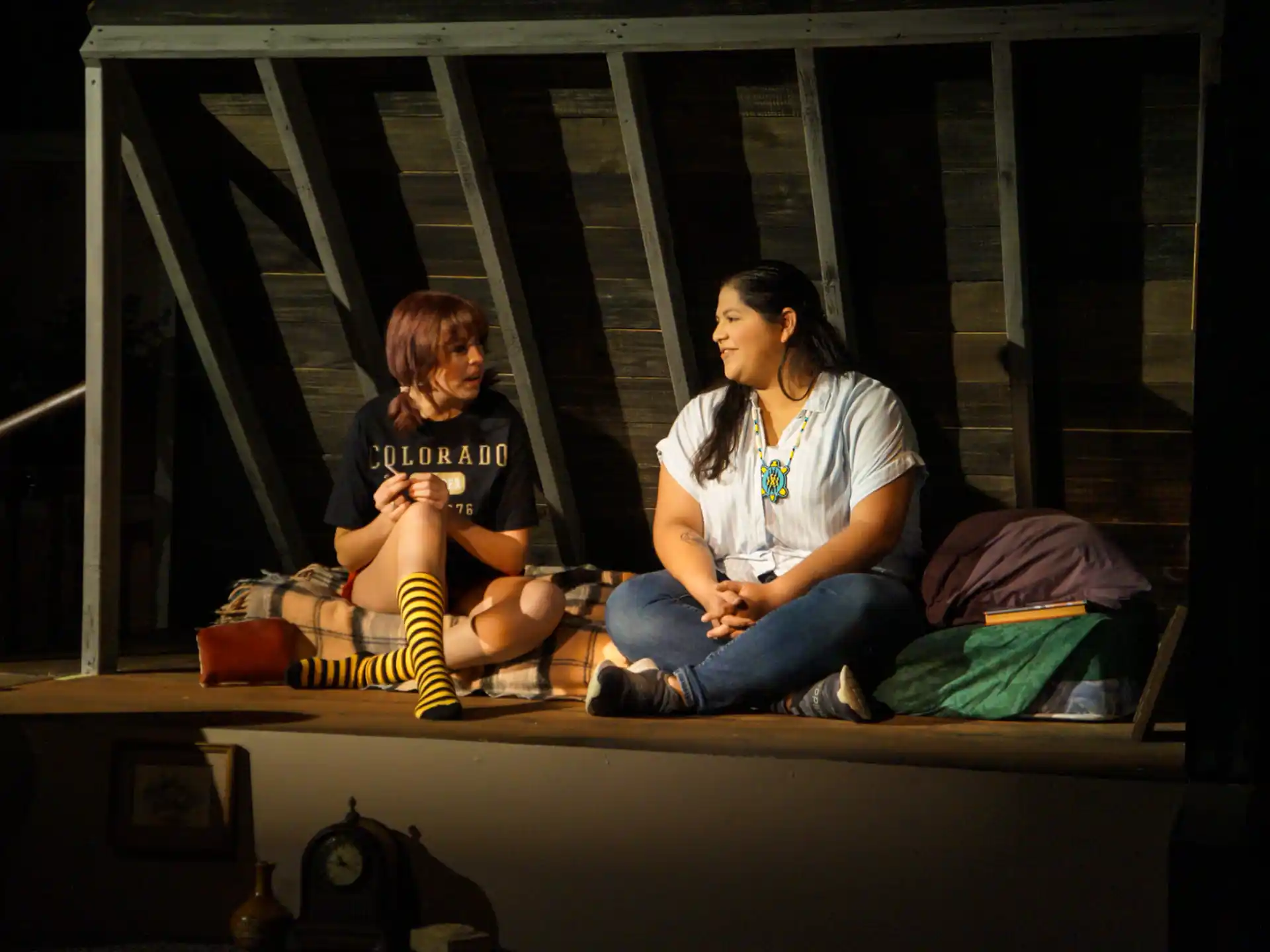 a couple of women sitting on a bench