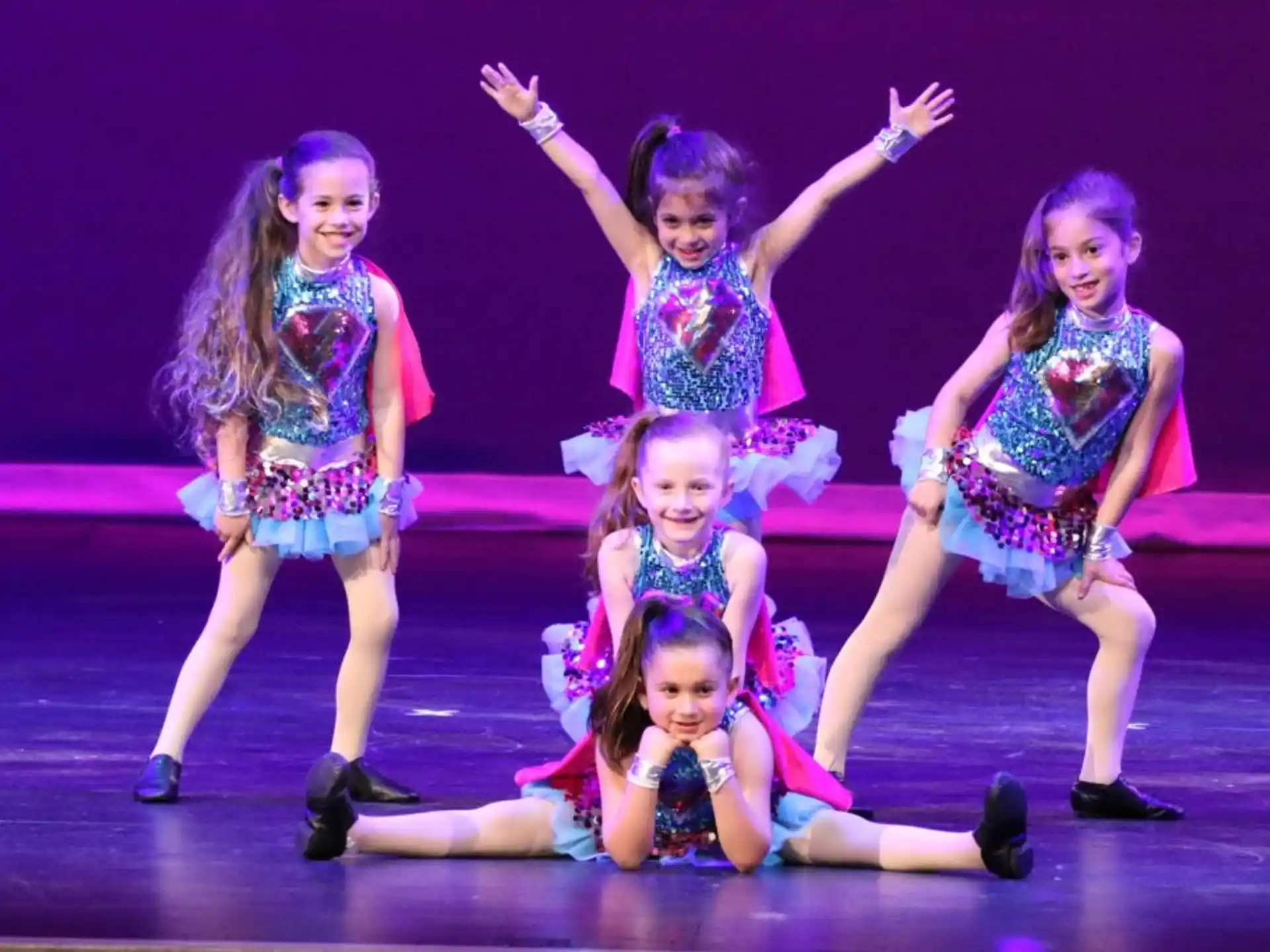 a group of girls on a stage