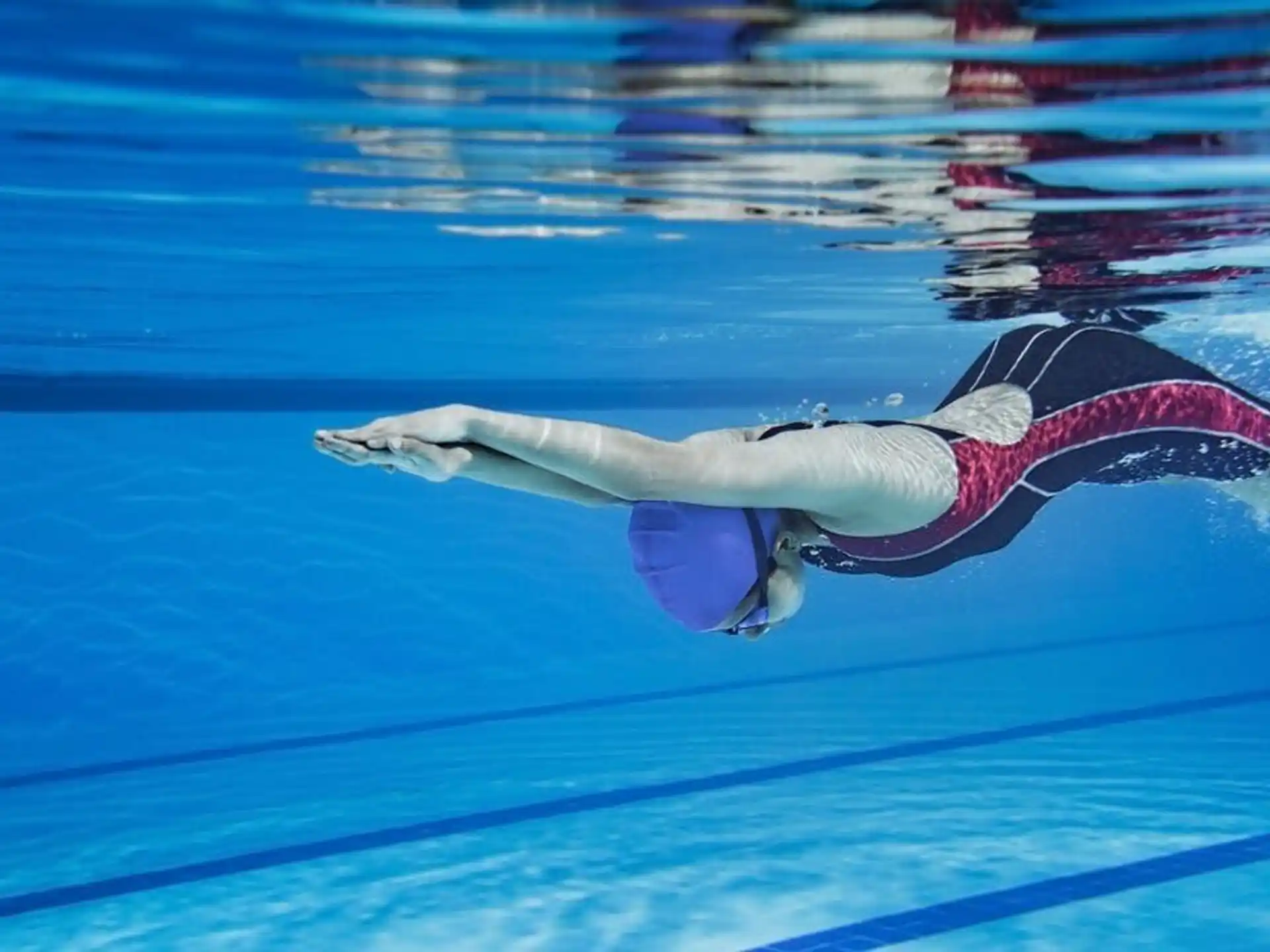 a person swimming in a pool