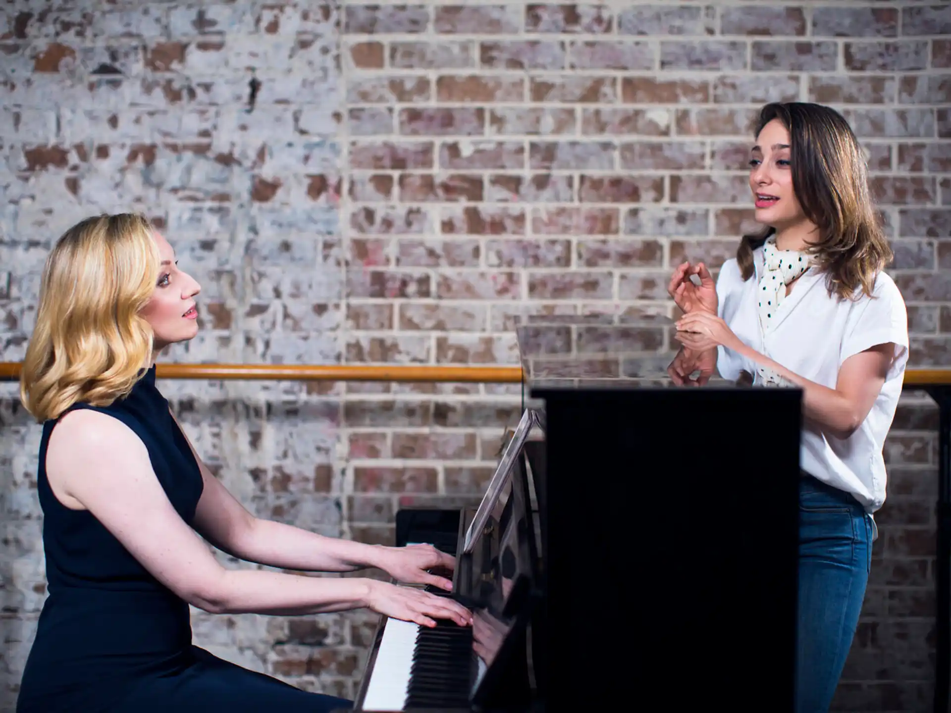 a woman playing a piano