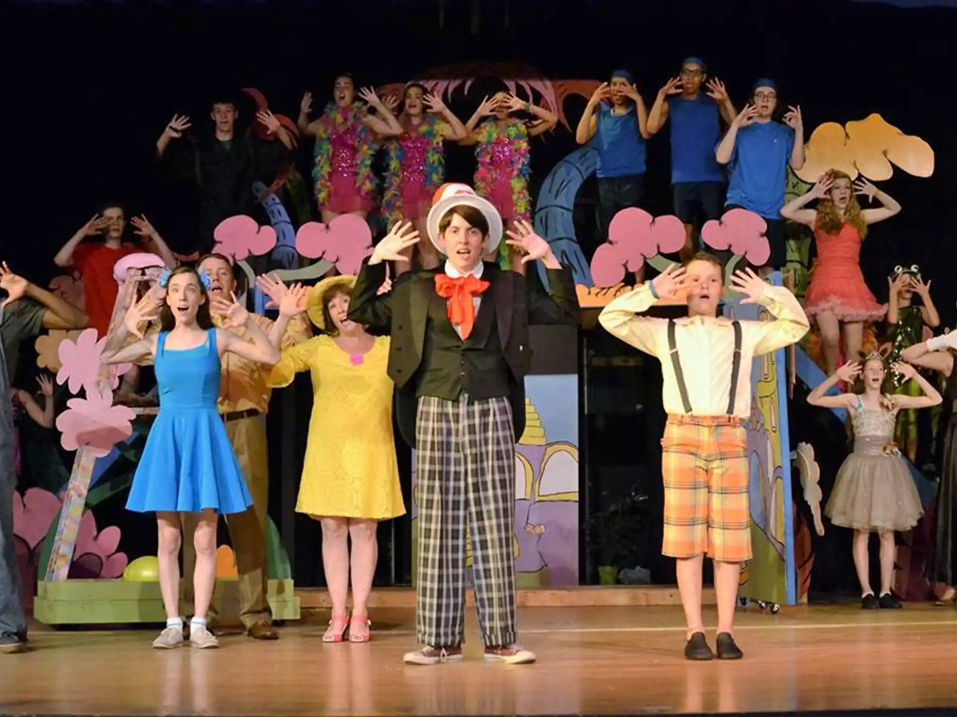 a group of children performing on stage