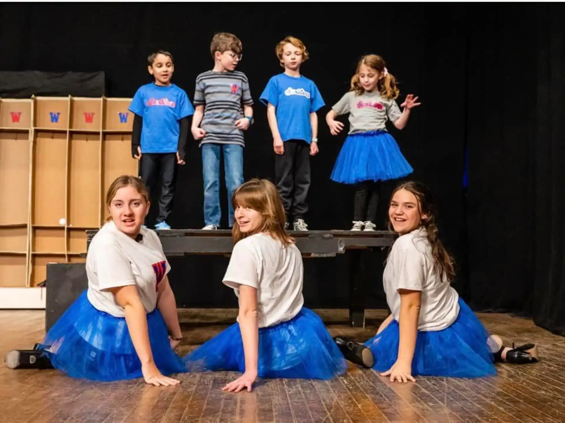 a group of children on a stage