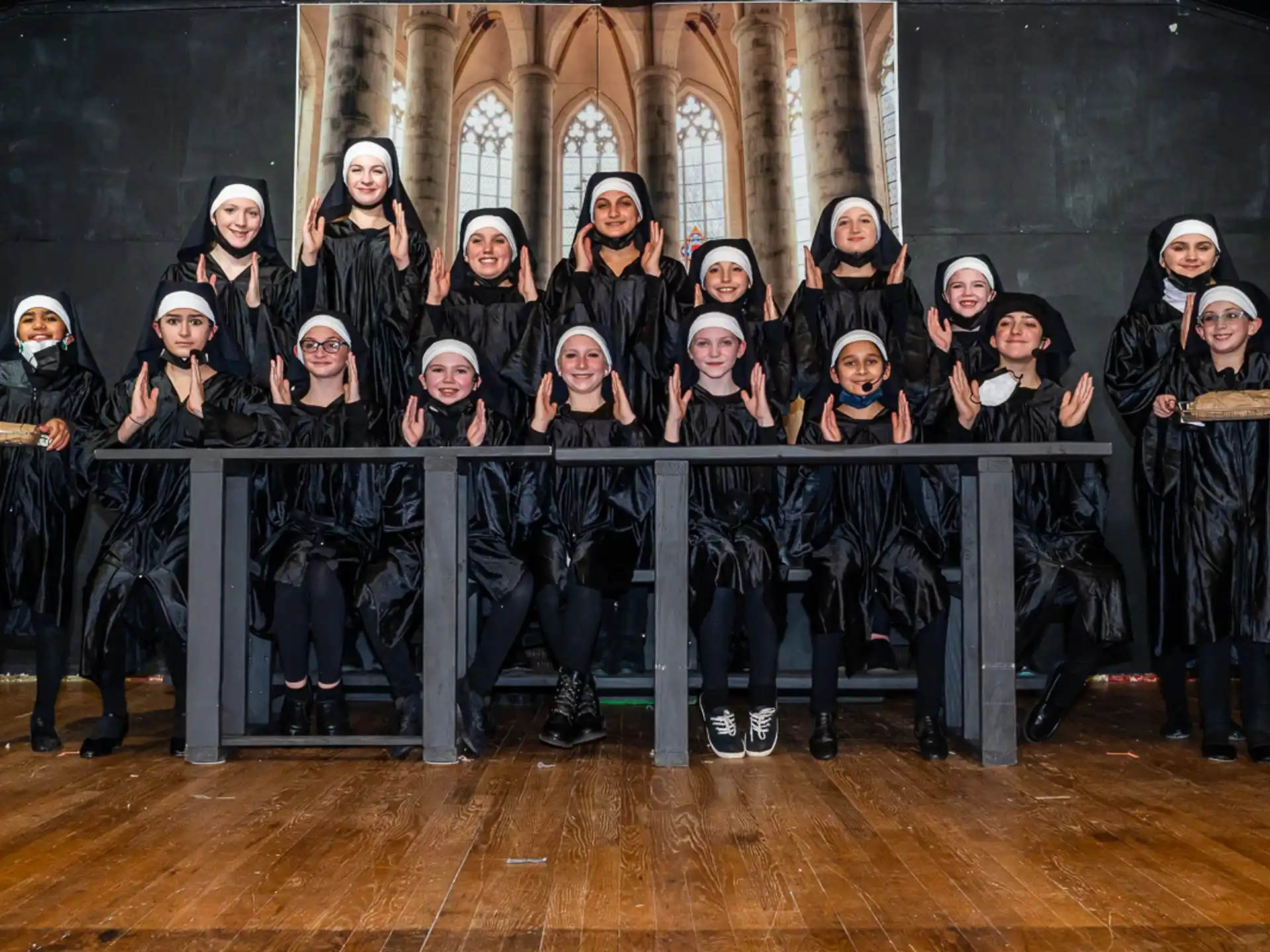 a group of people in black robes