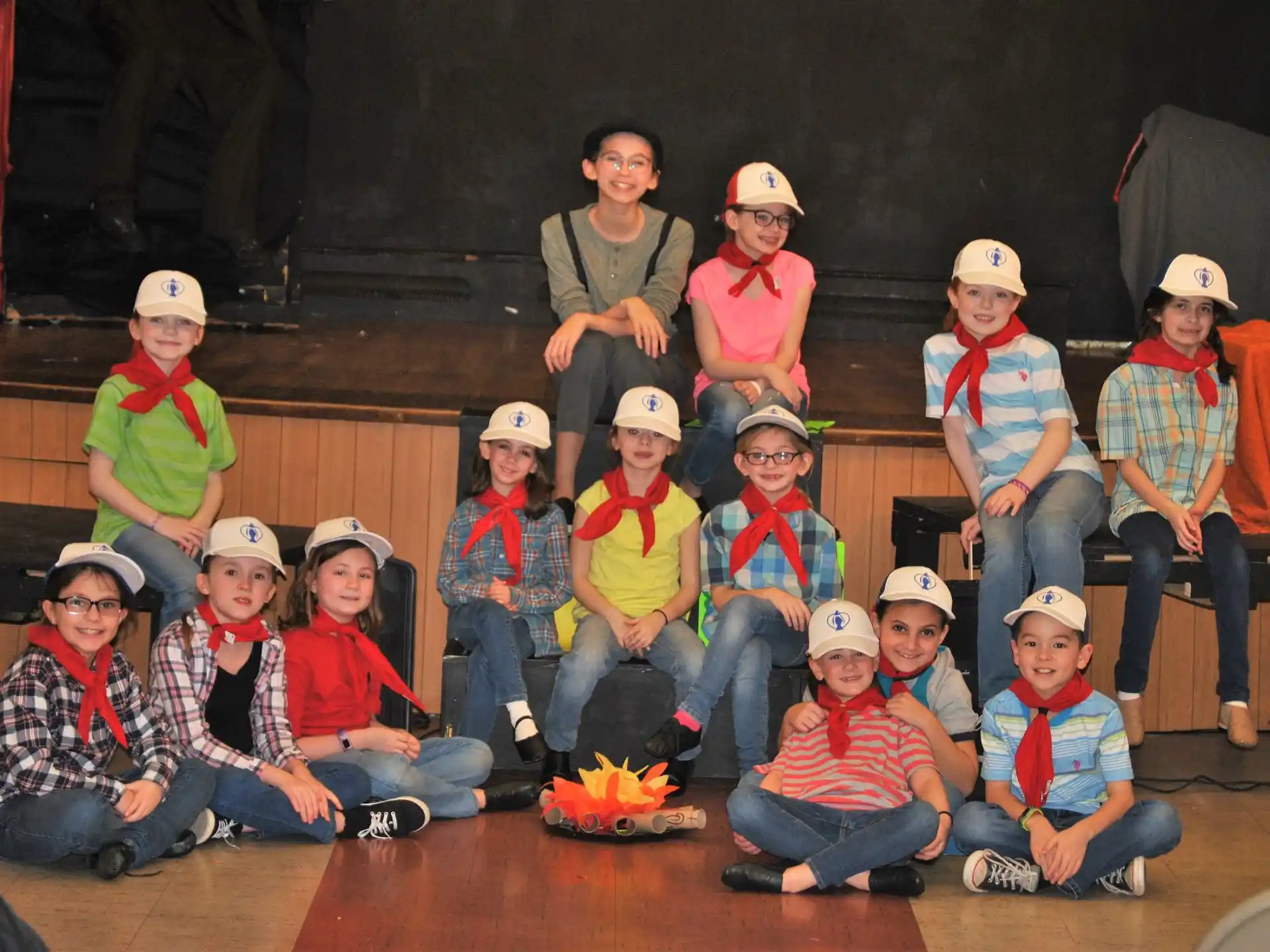 a group of people wearing hardhats and posing for a photo