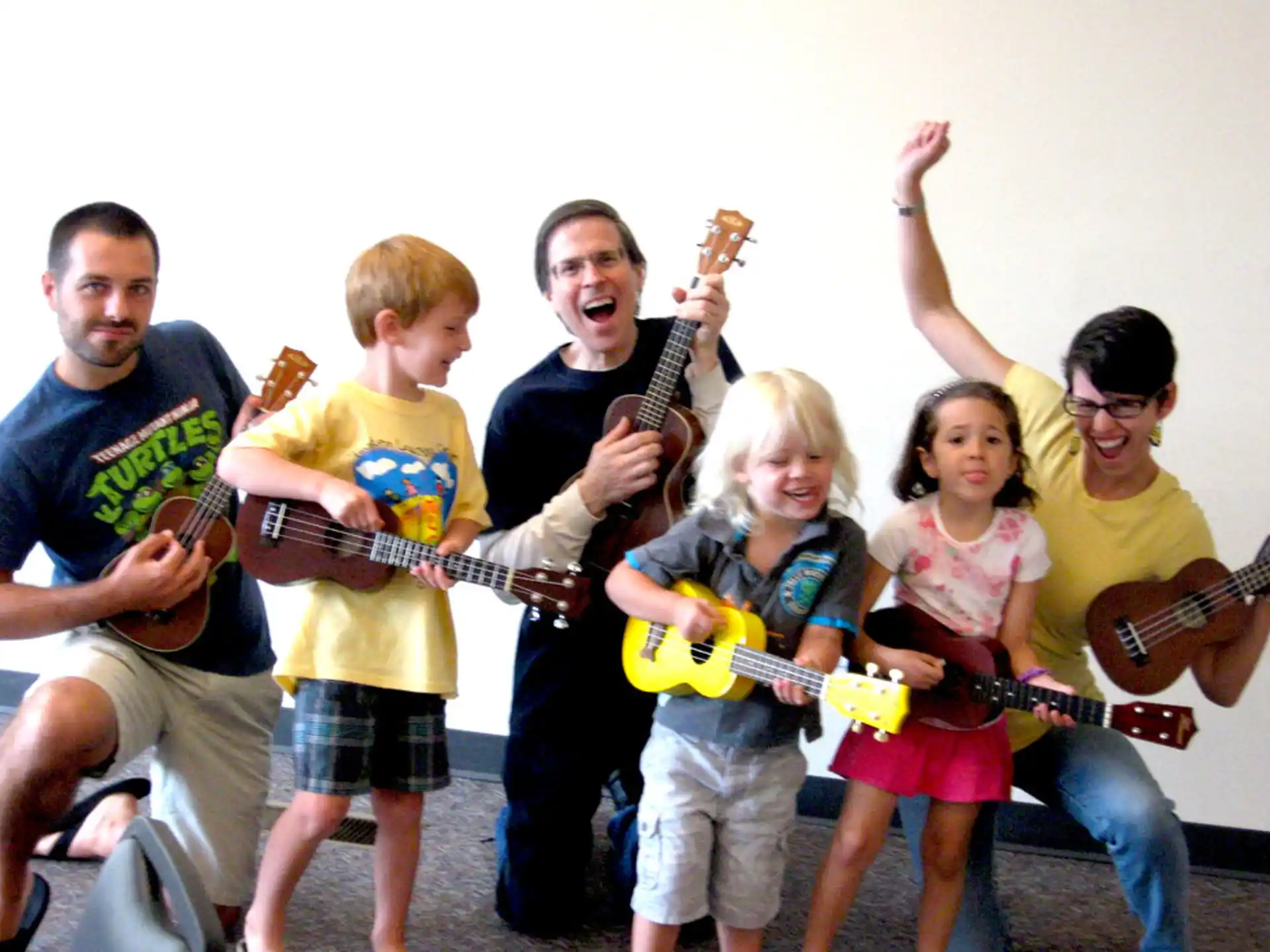 a group of people holding guitars