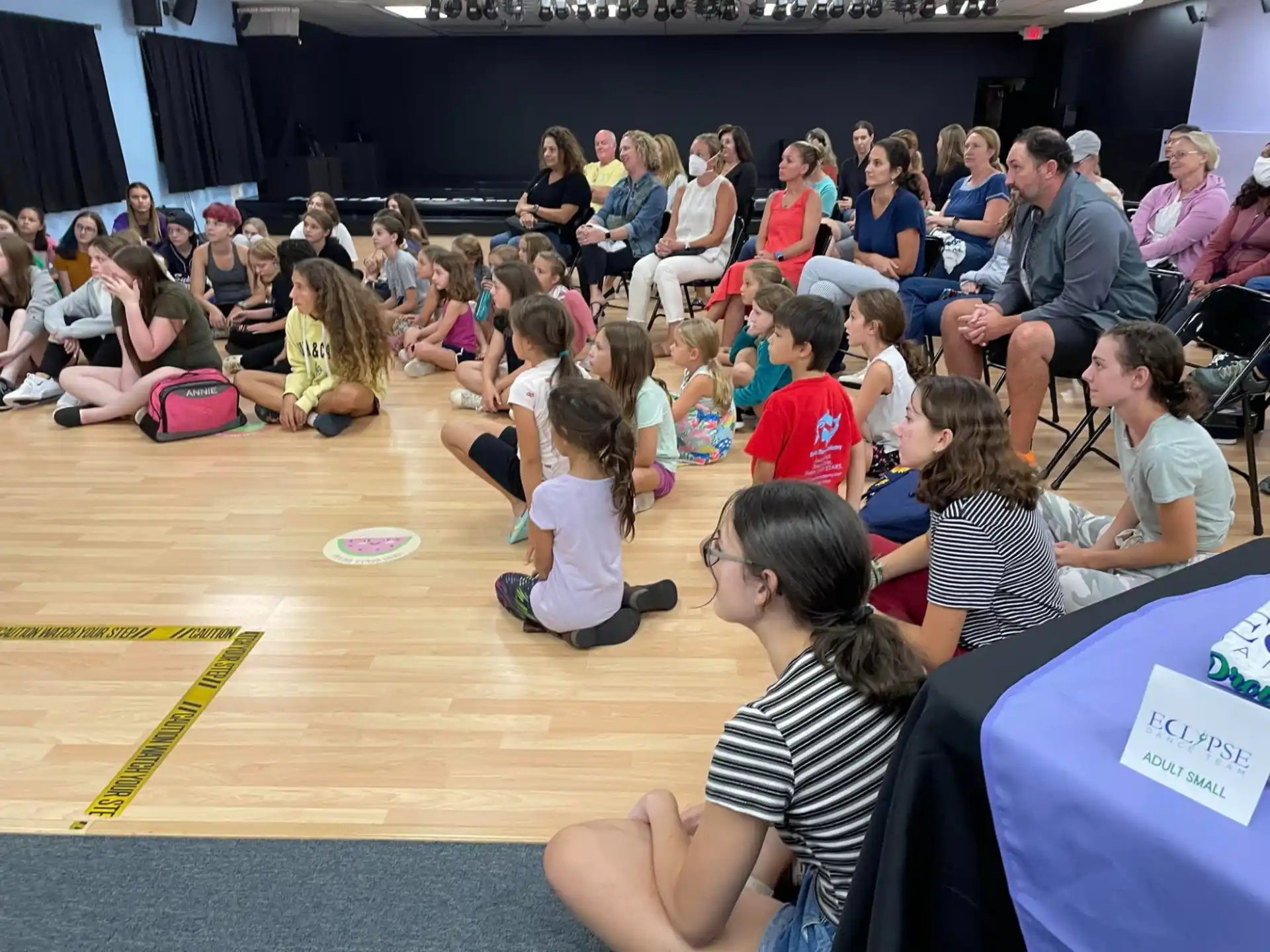 a group of people sitting on the floor