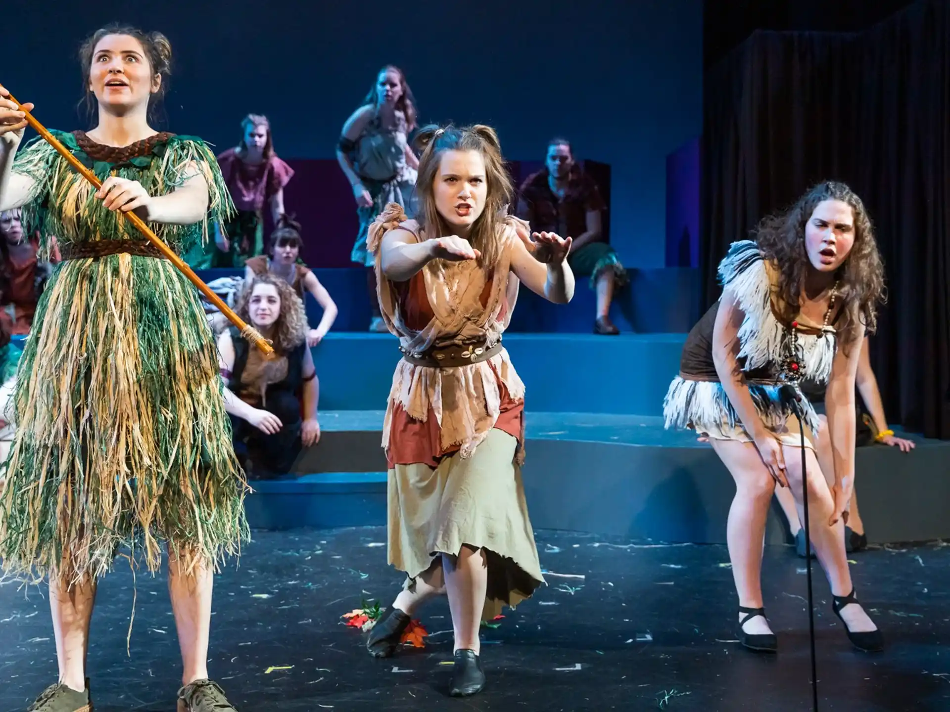 a group of women dancing on a stage
