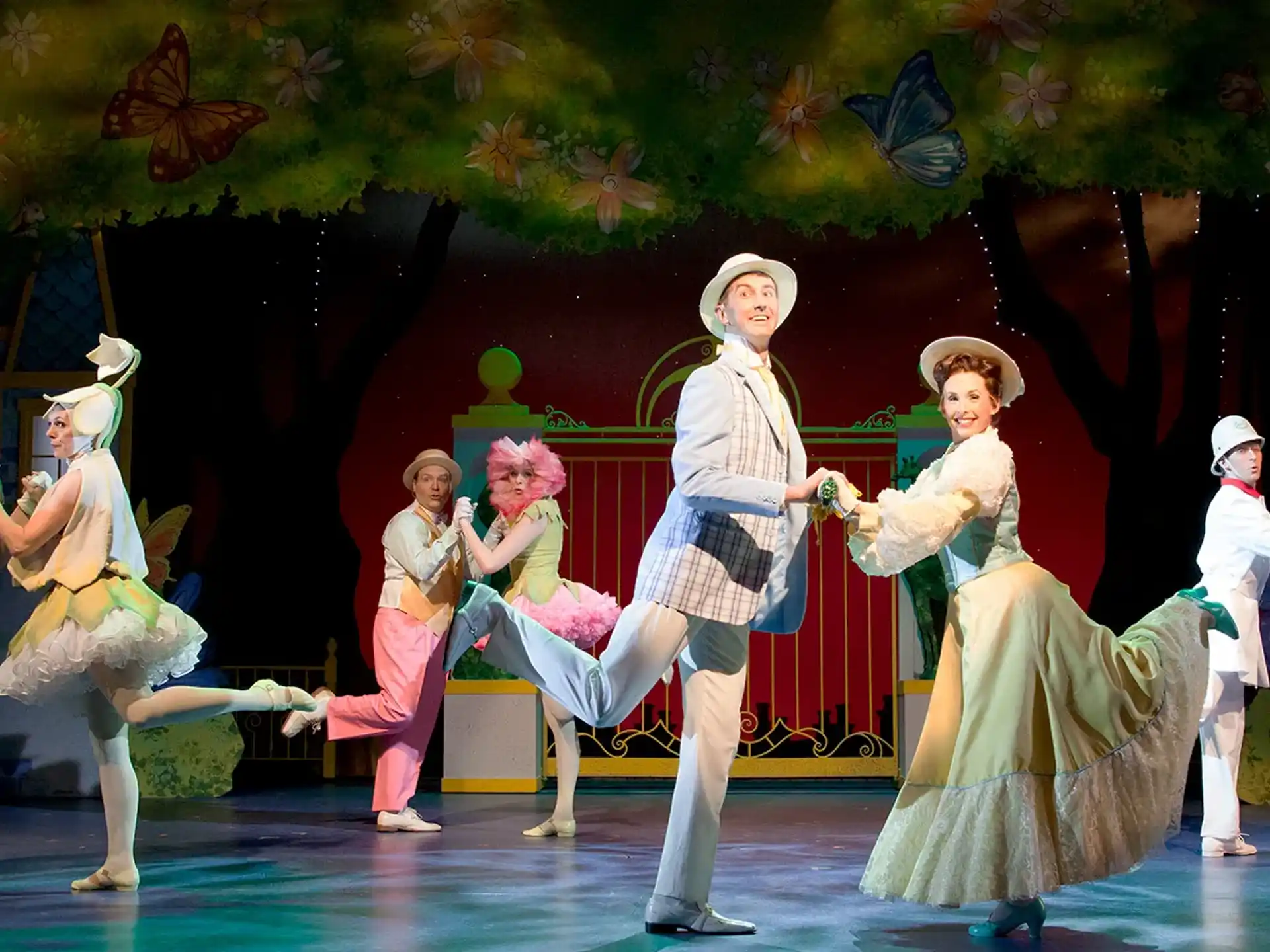 a group of people dancing on a stage