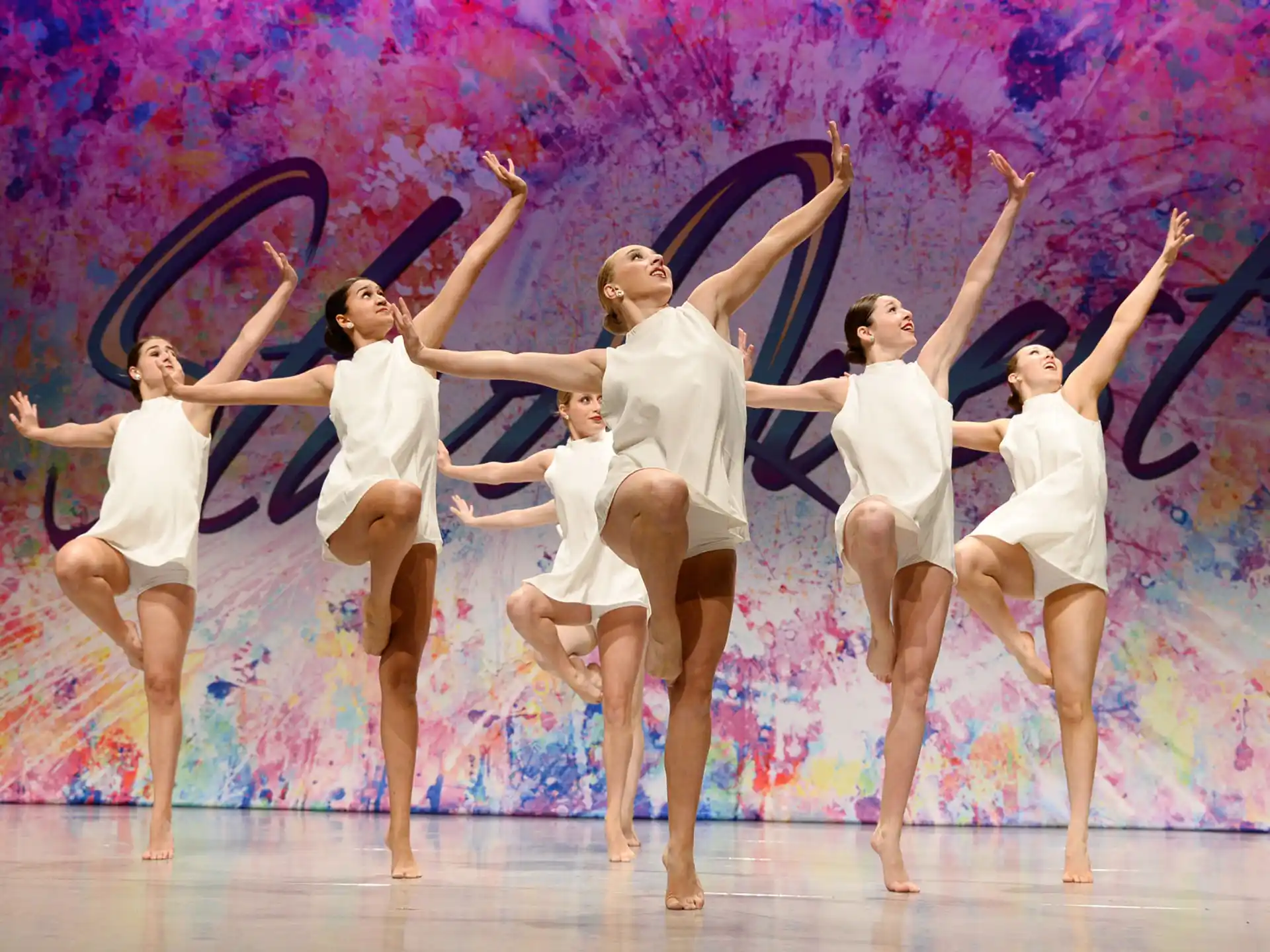 a group of women dancing on a stage