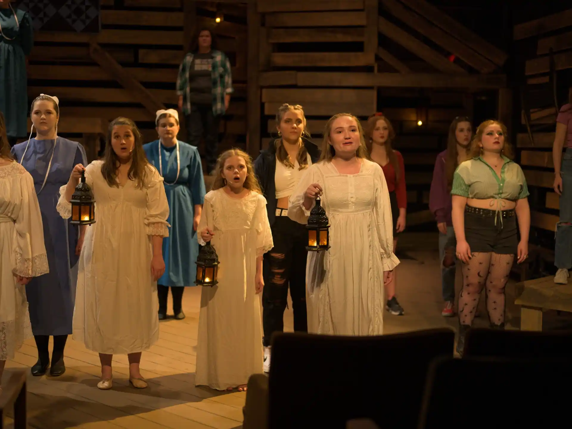 a group of people standing on a stage