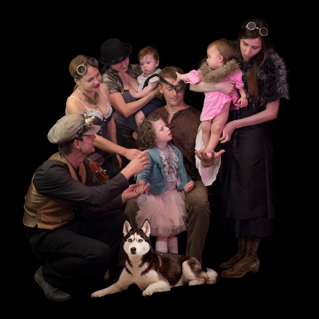 a group of people posing for a photo with a dog