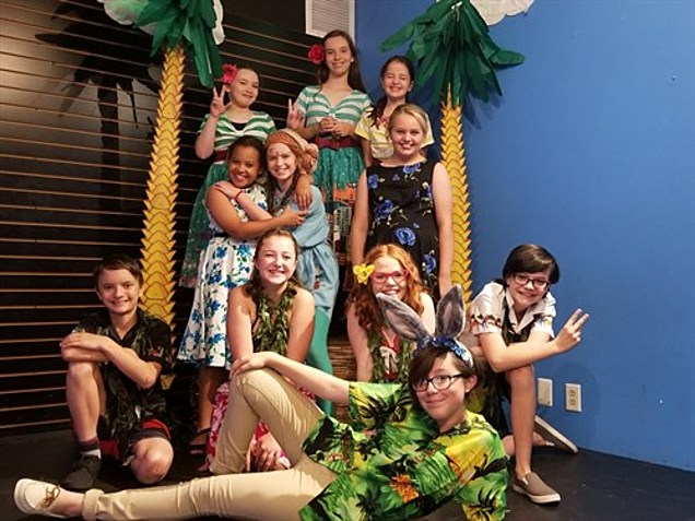 a group of people posing for a photo