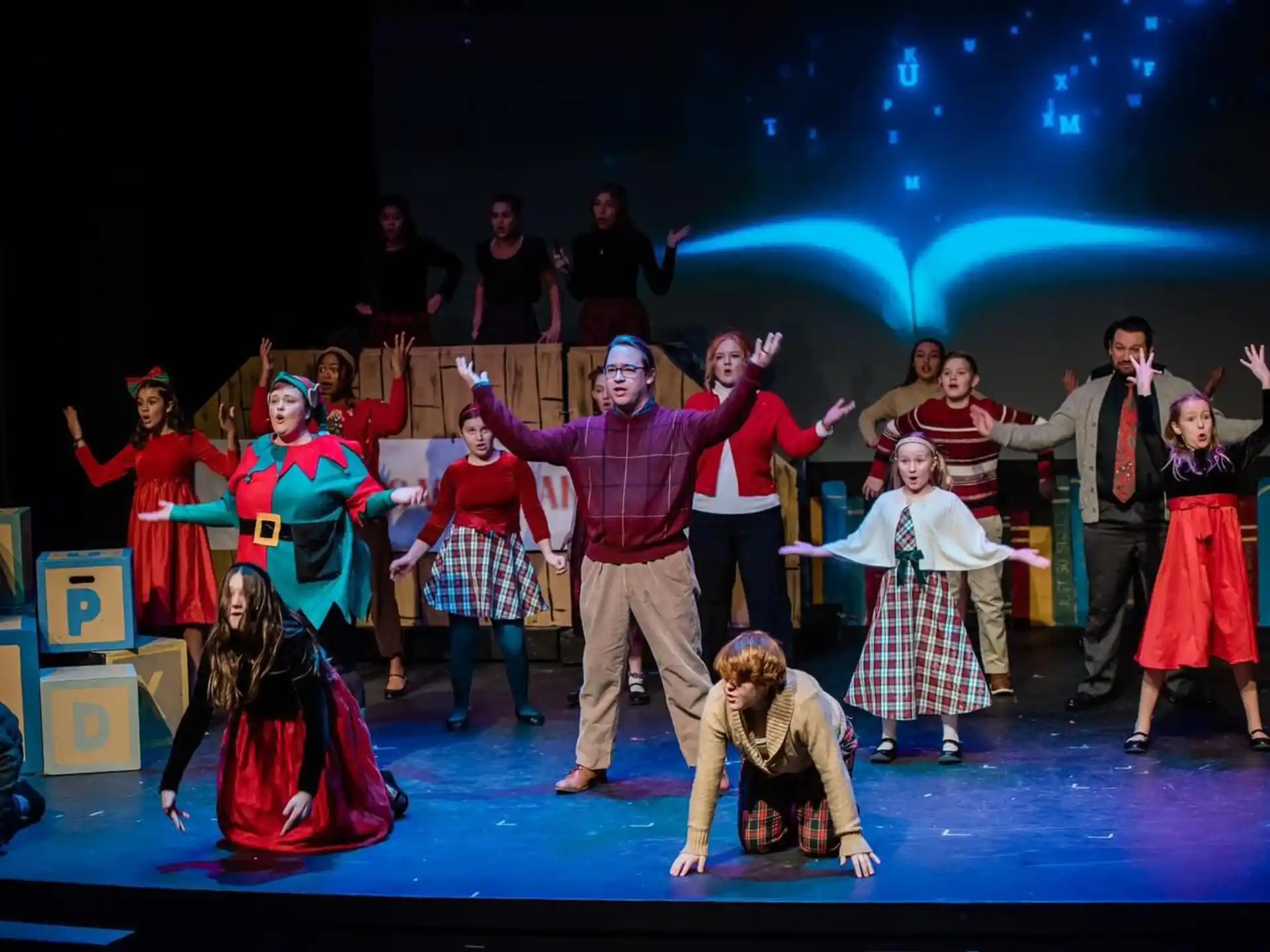 a group of people dancing on a stage
