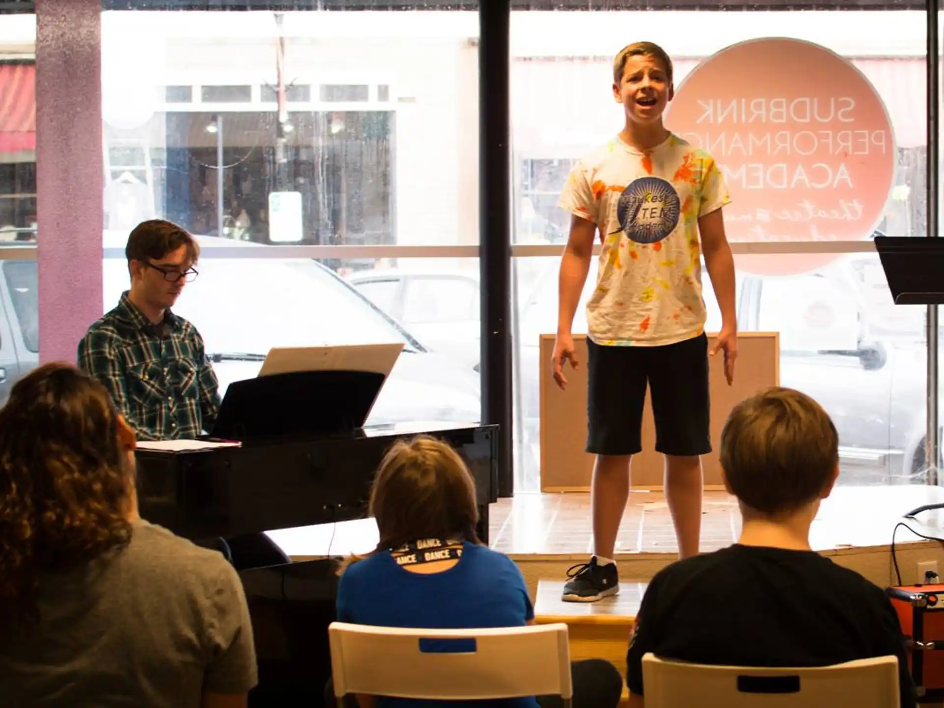 a person standing in front of a group of people
