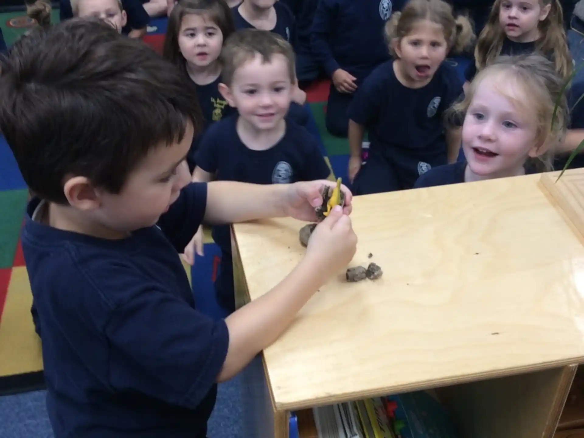 a group of children playing with toys