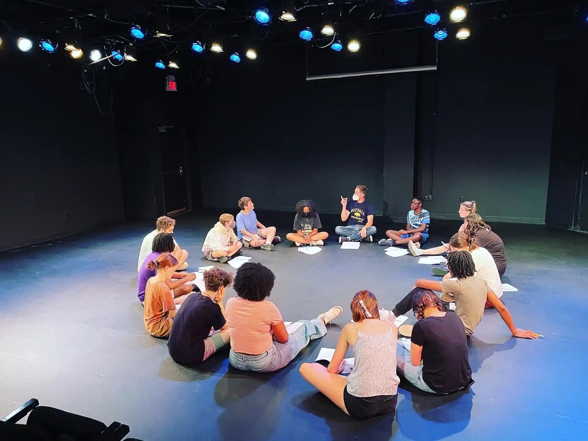 a group of people sitting on the floor