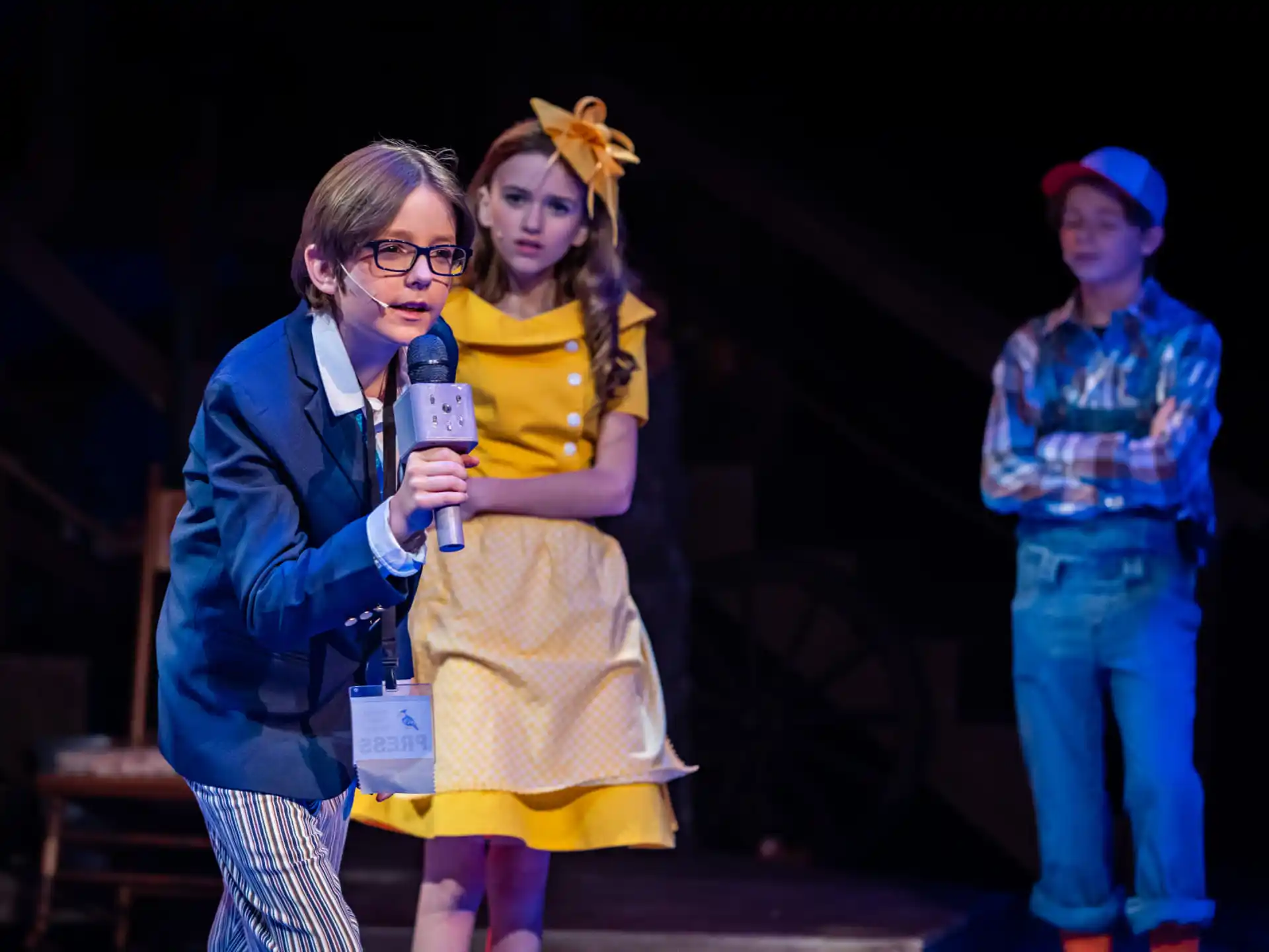 a person holding a microphone and a girl holding a microphone