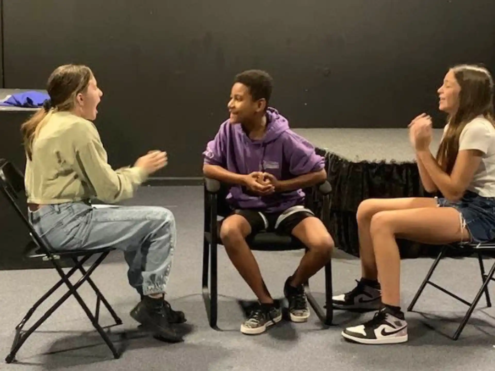a group of people sitting in chairs