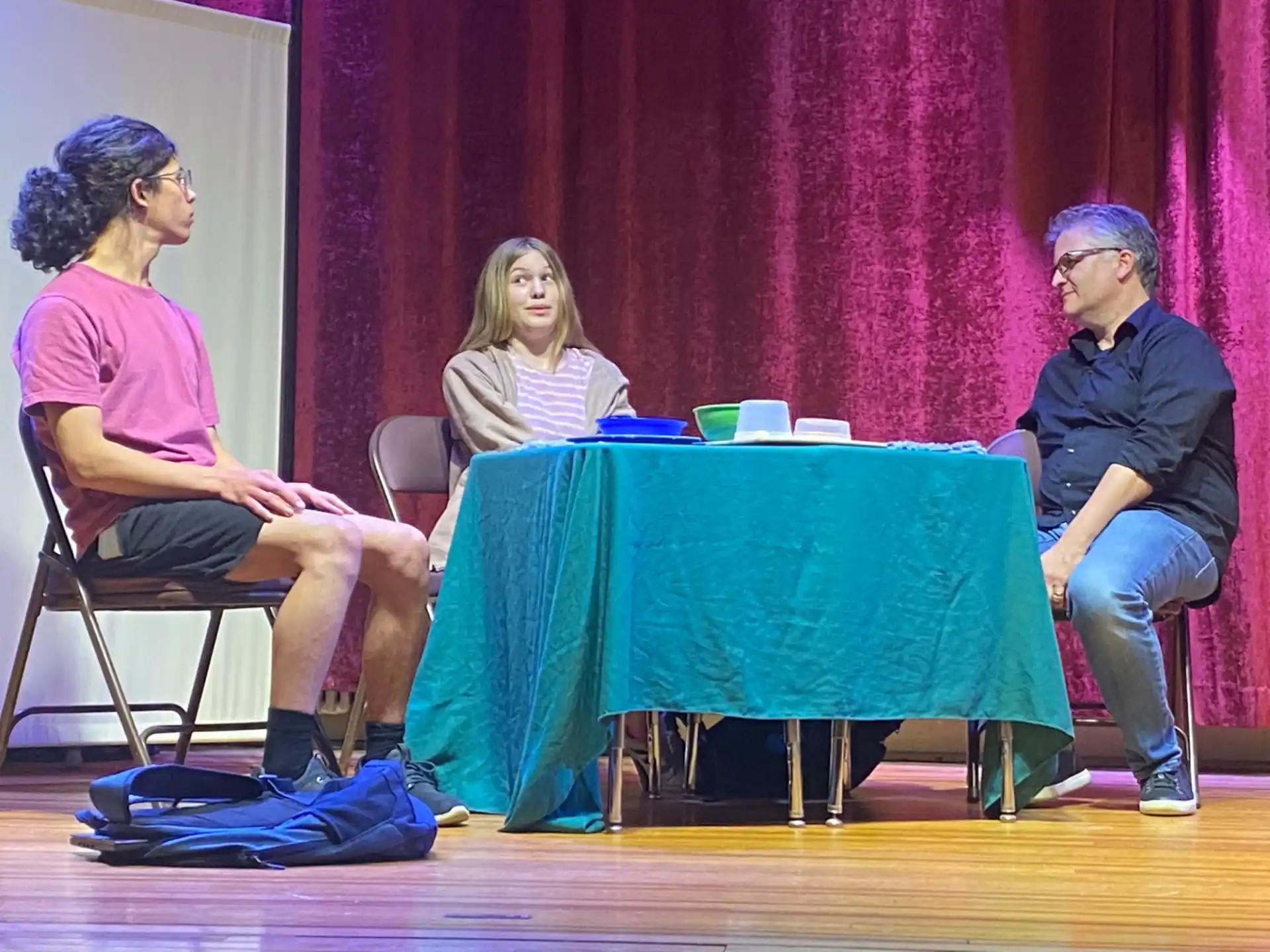 a group of people sitting around a table