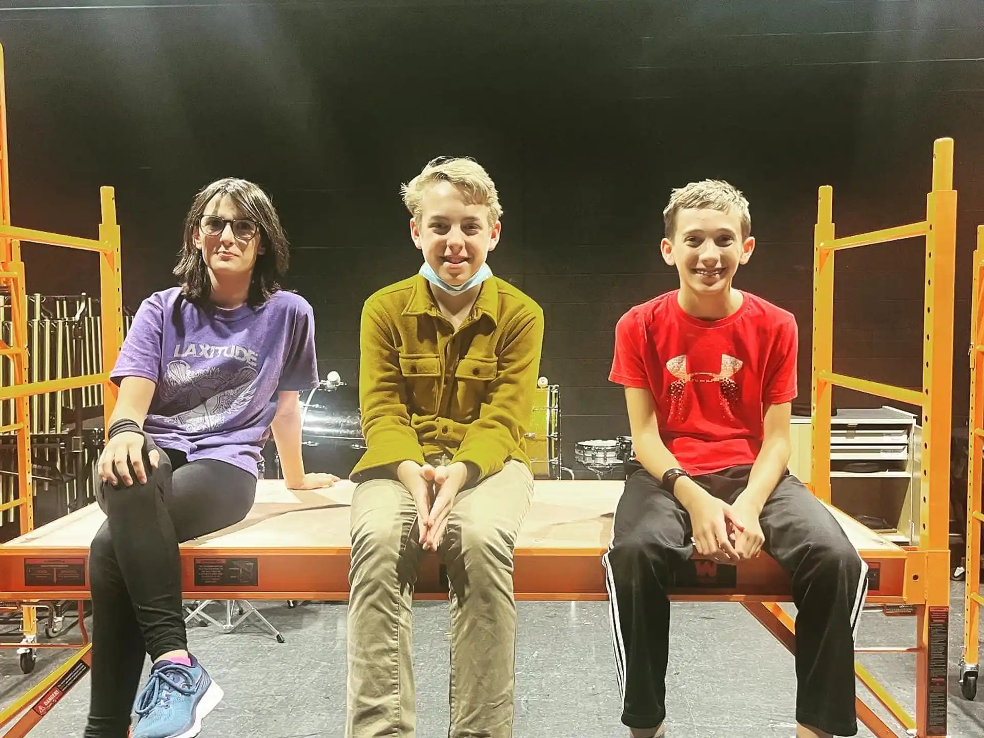a group of people sitting on a bench