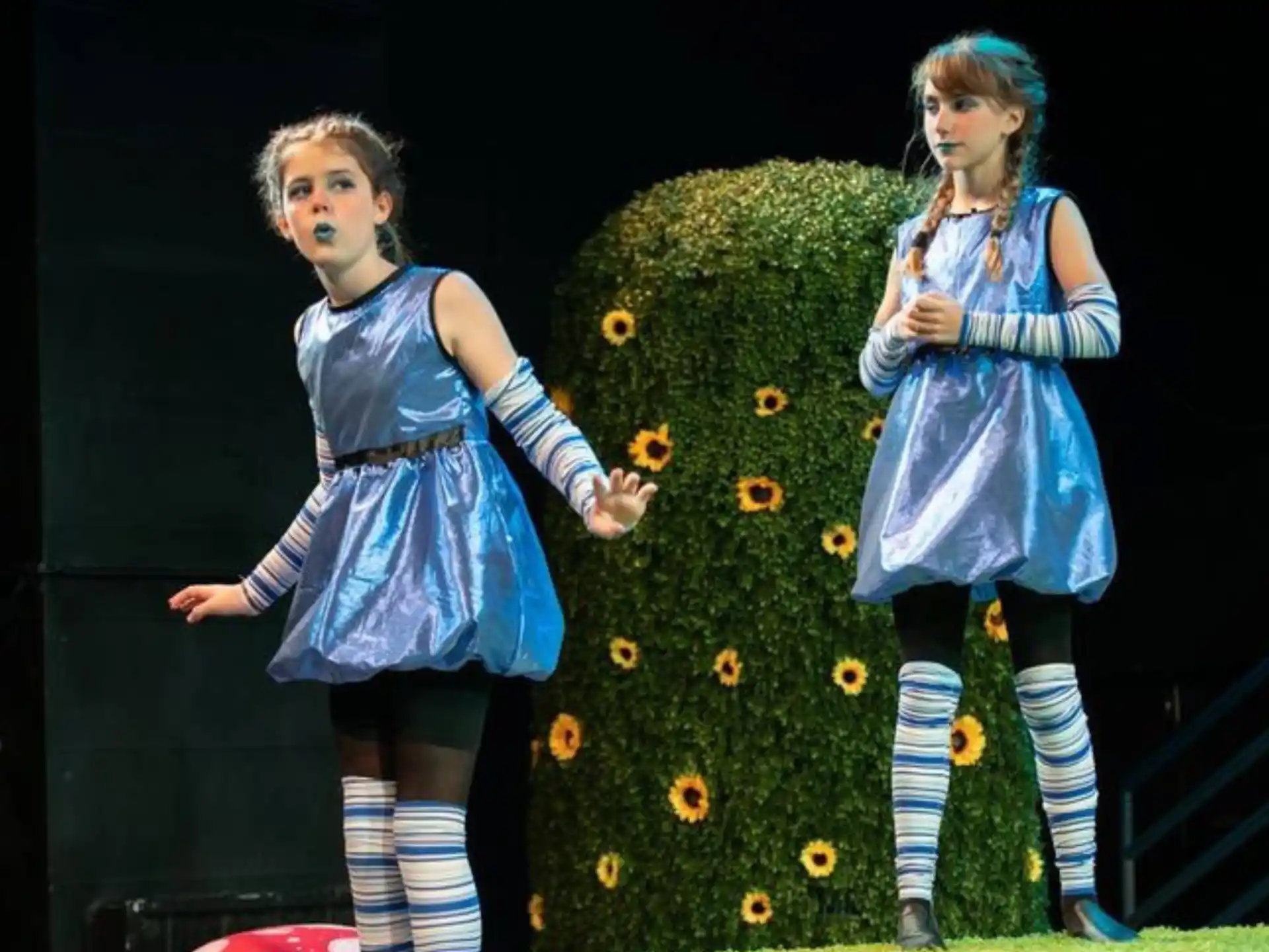 two girls in blue dresses