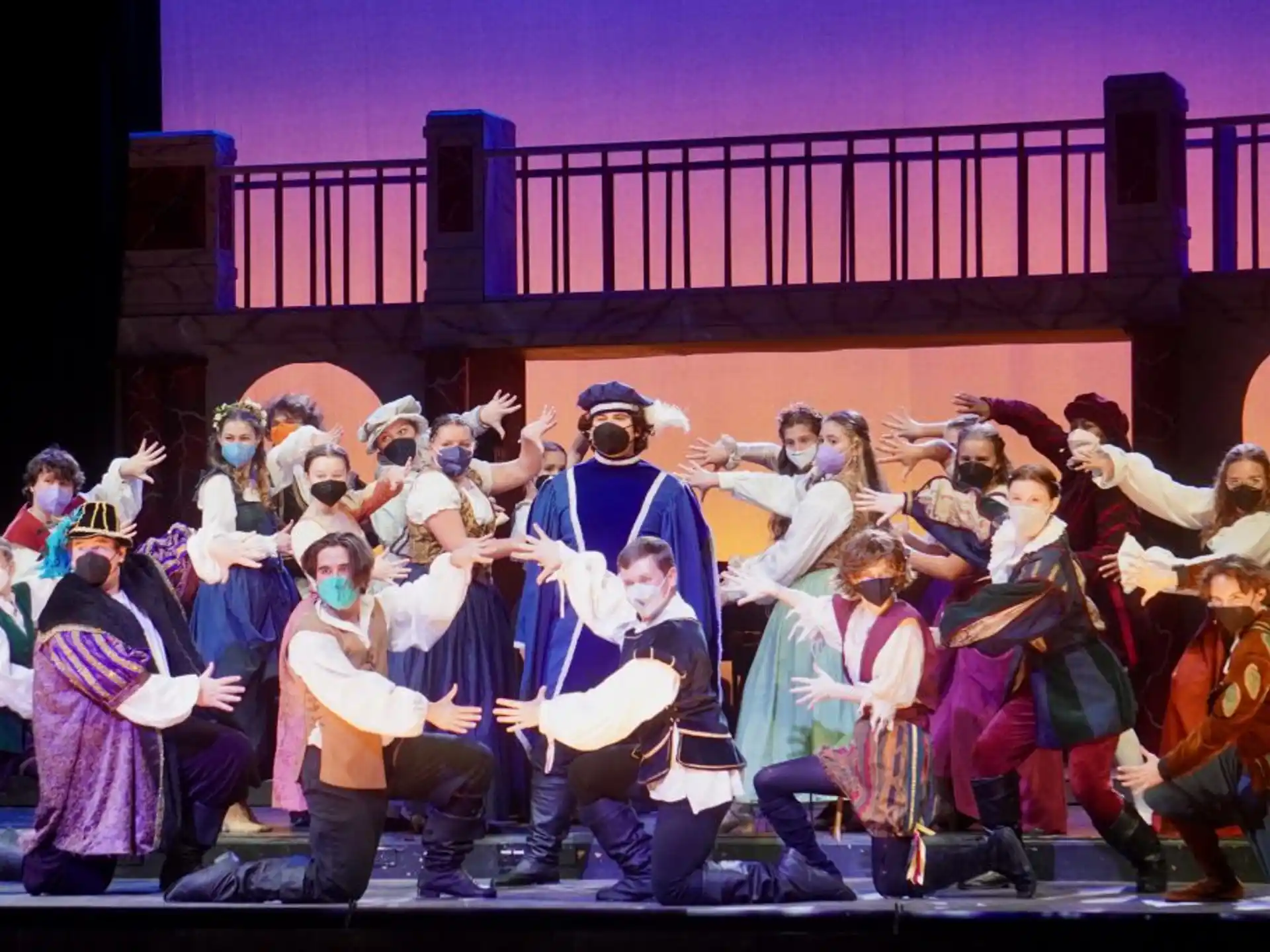 a group of people in clothing on a stage