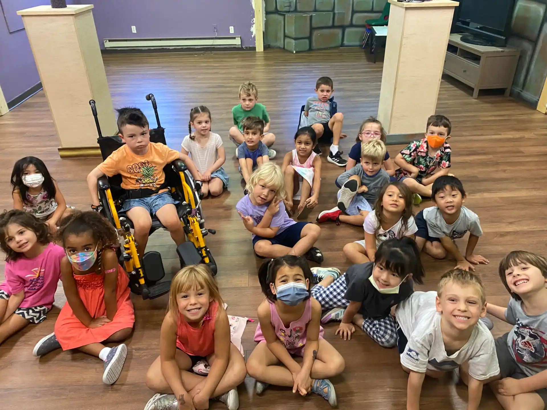 a group of children sitting on the floor