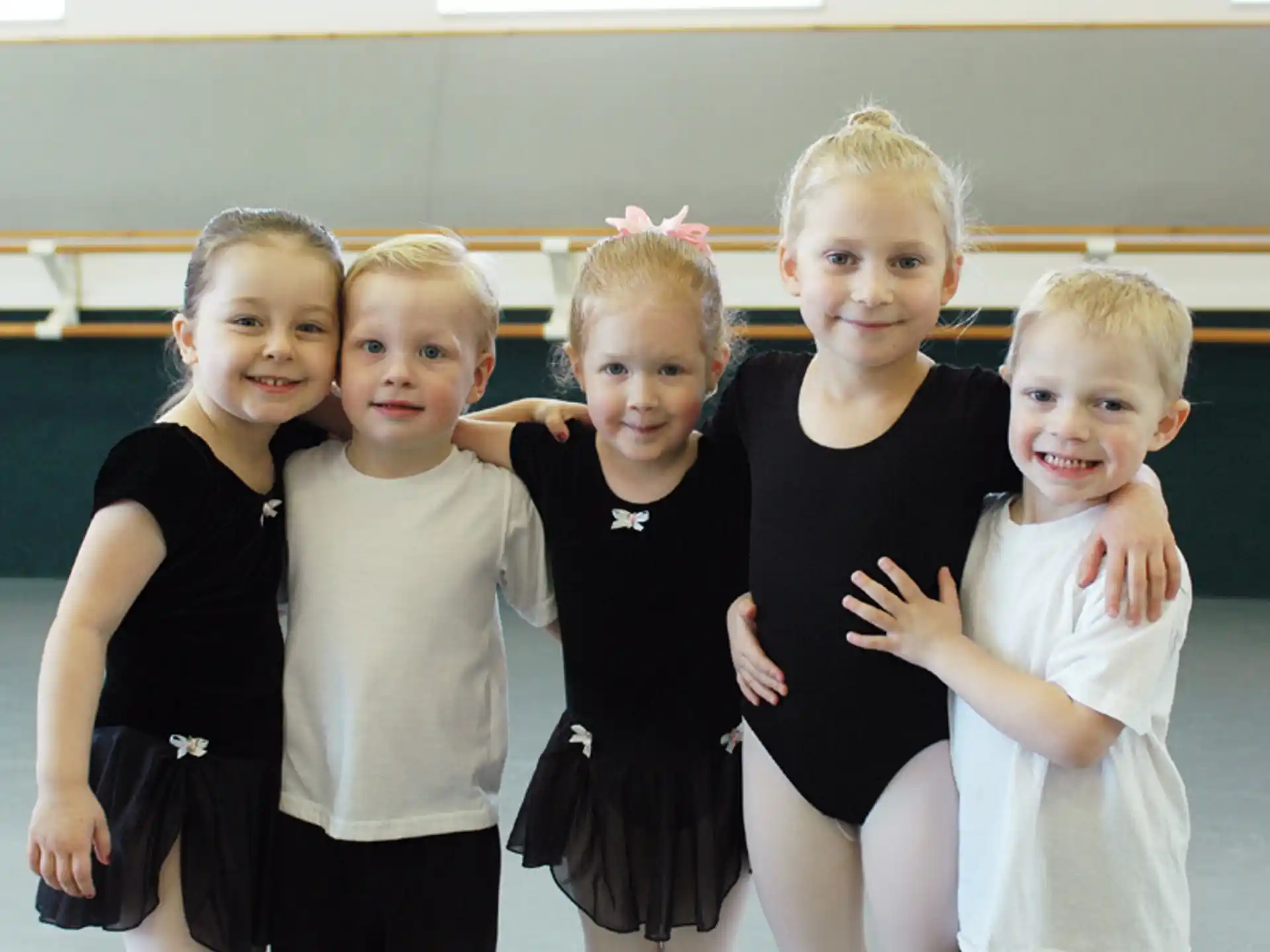 a group of girls posing for a photo