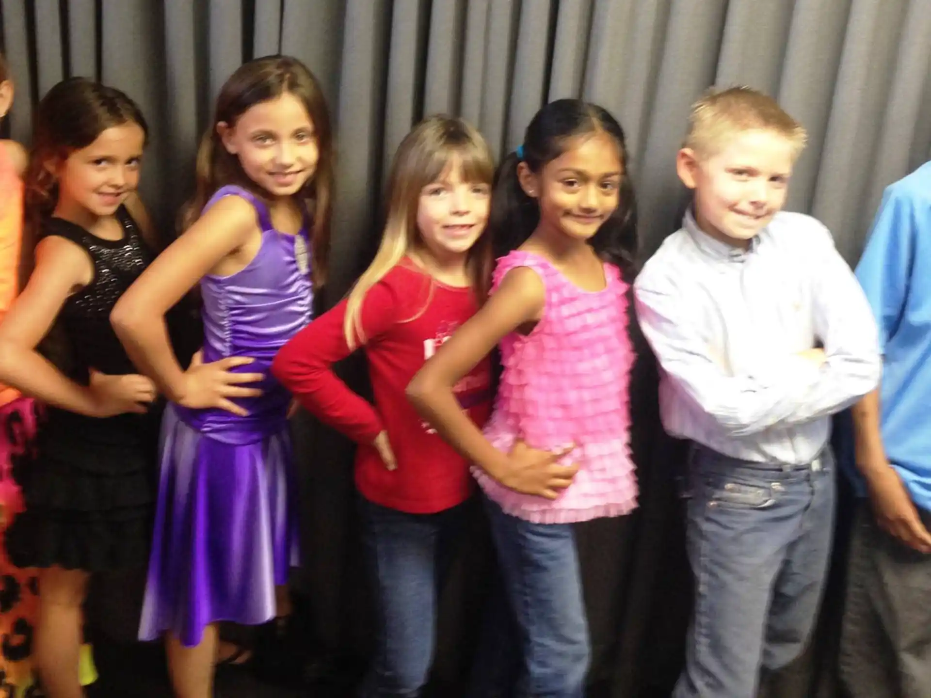 a group of children posing for a photo
