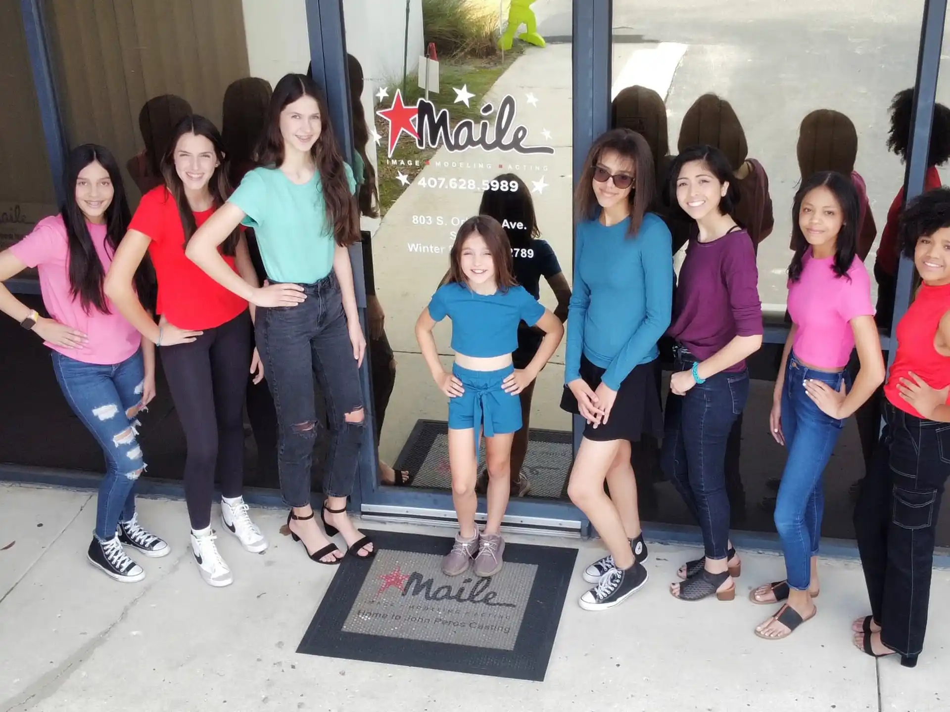 a group of women posing for a photo