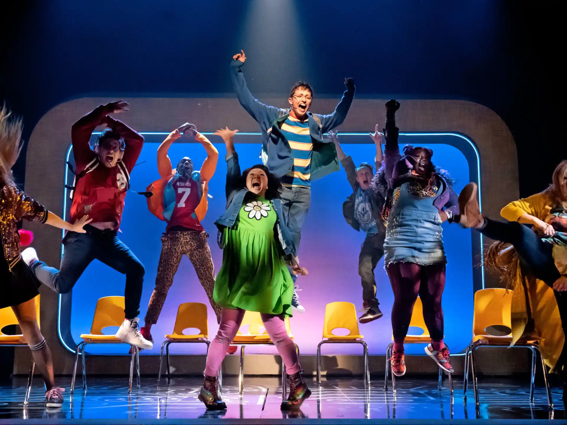 a group of people dancing on a stage