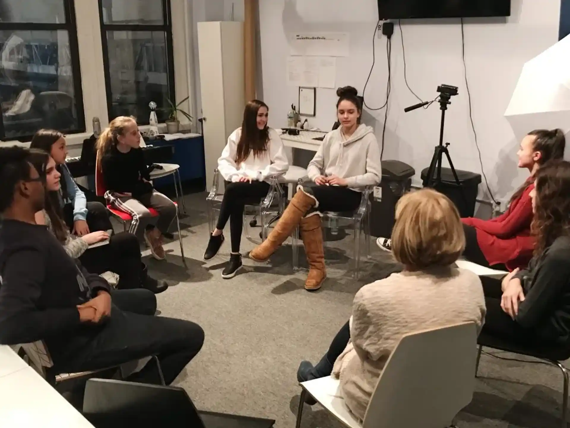 a group of people sitting in chairs