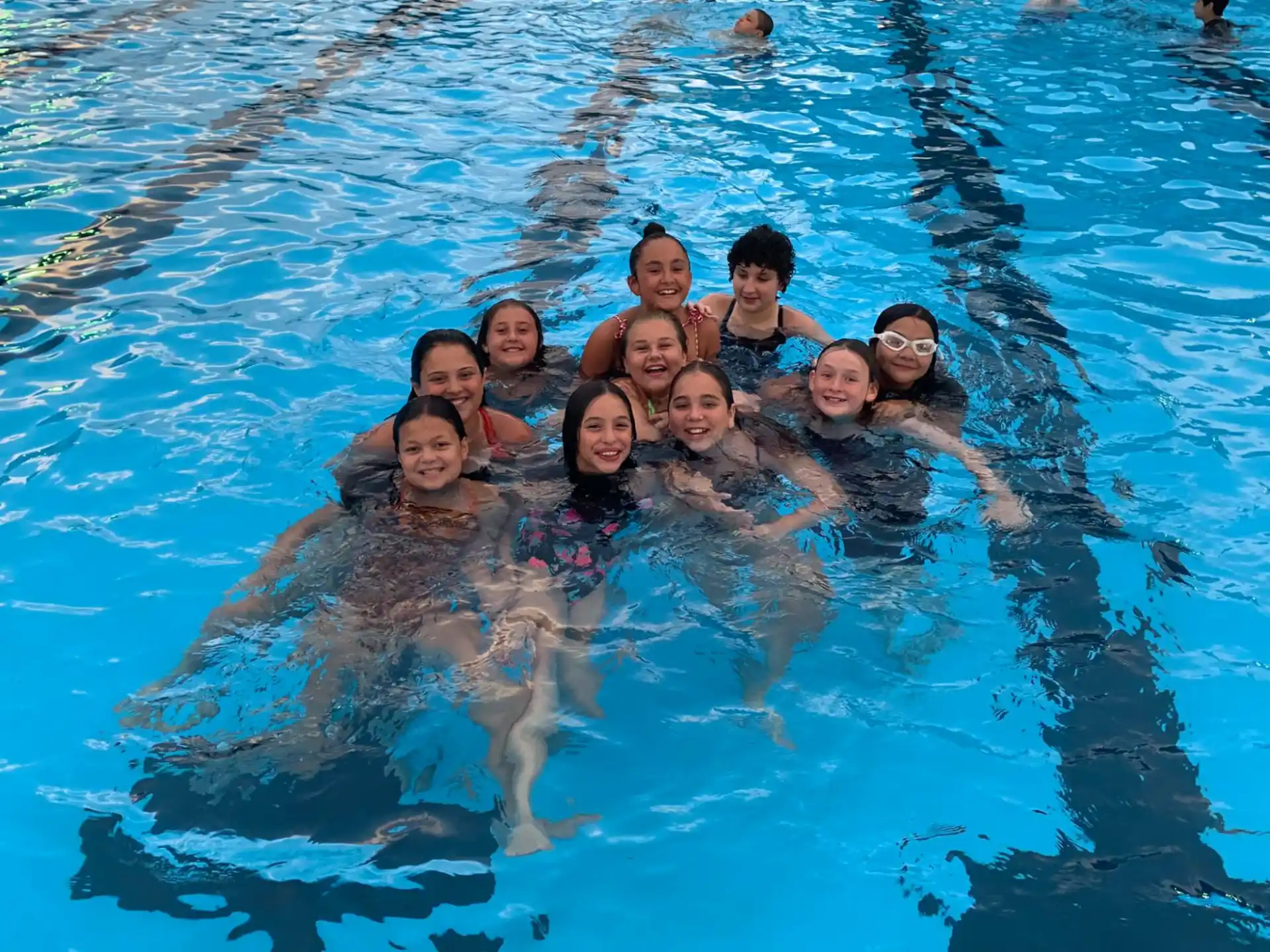 a group of people in a pool