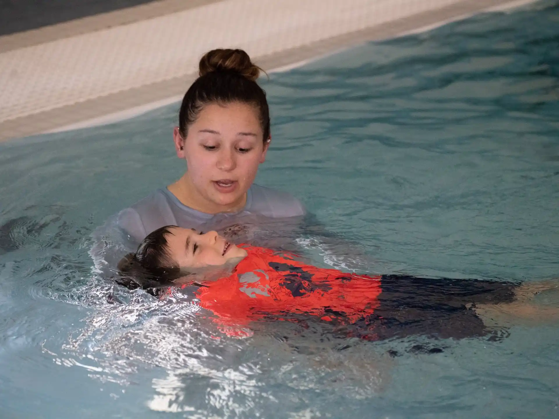 a man and a woman in a pool