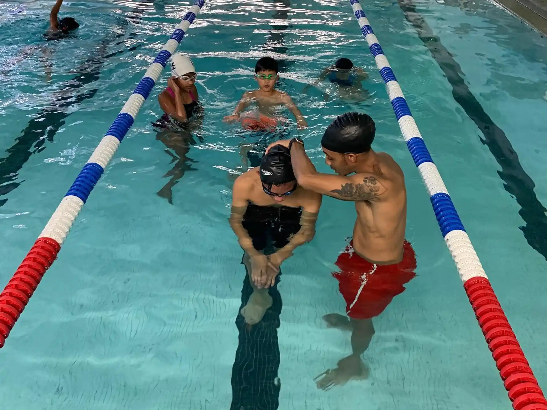 a group of people in a pool