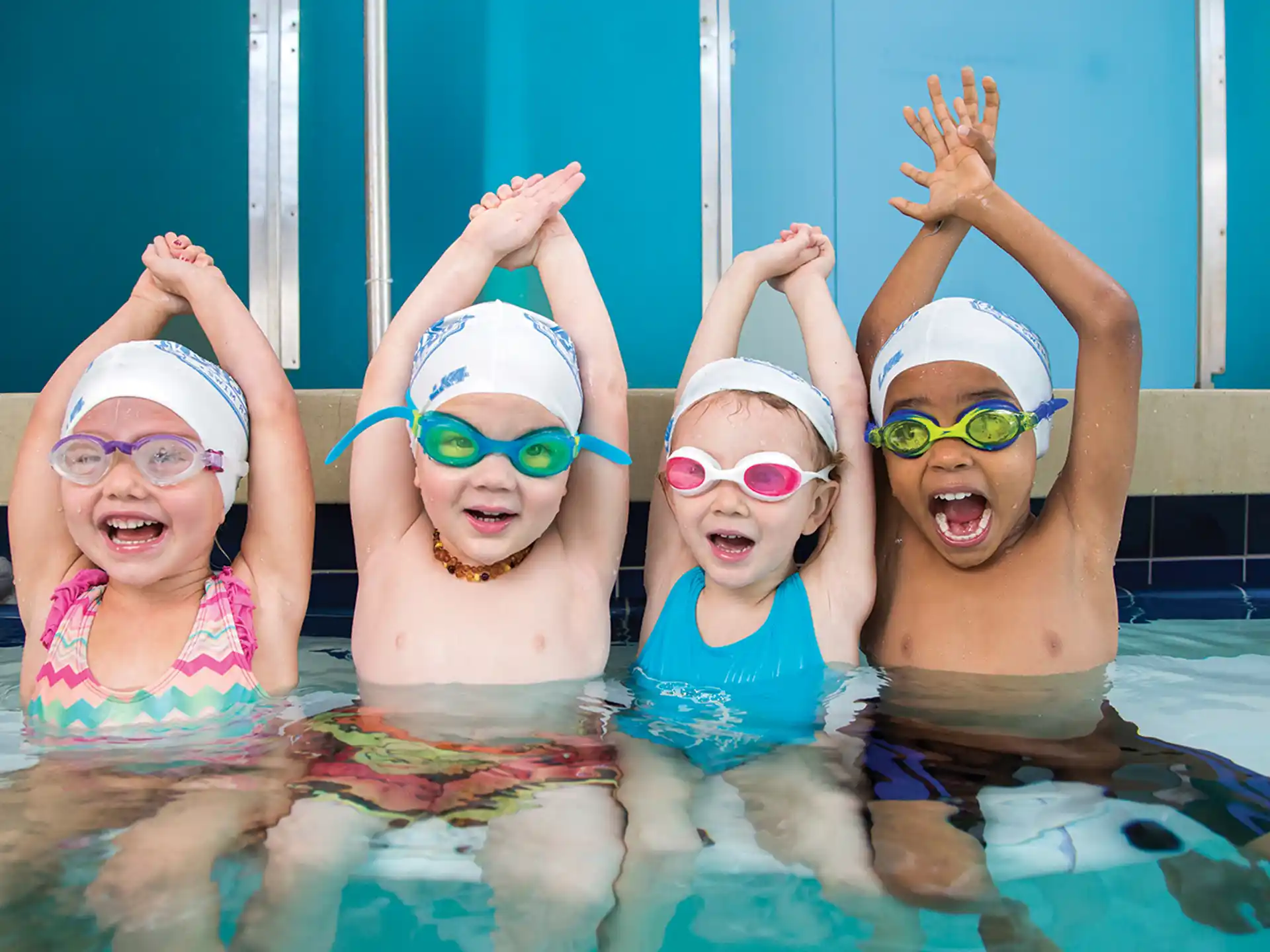 a group of children in a pool