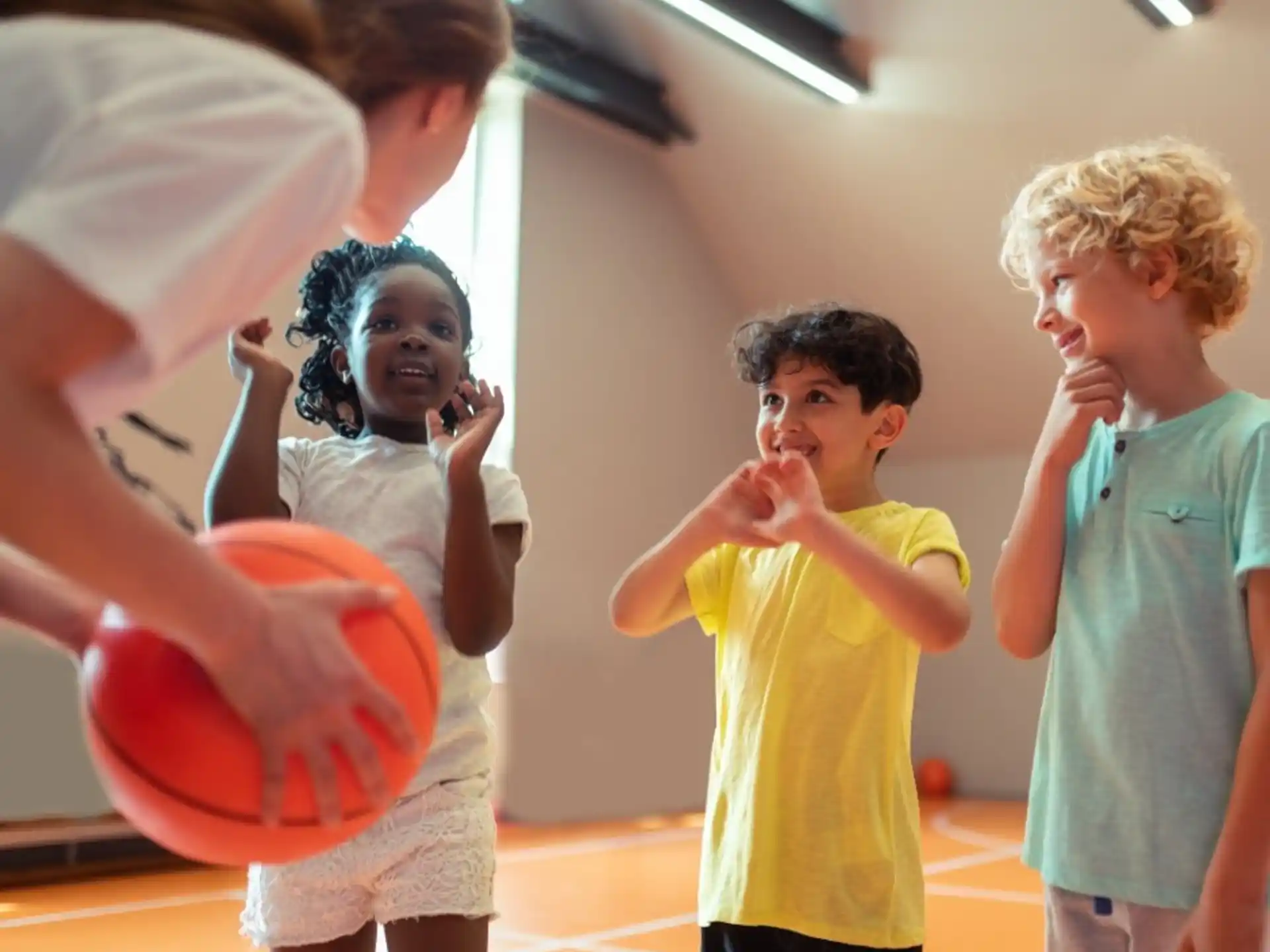 a group of kids playing with a ball