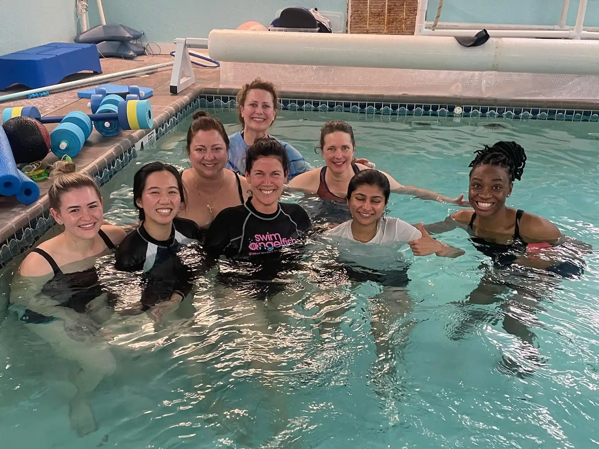 a group of people in a pool
