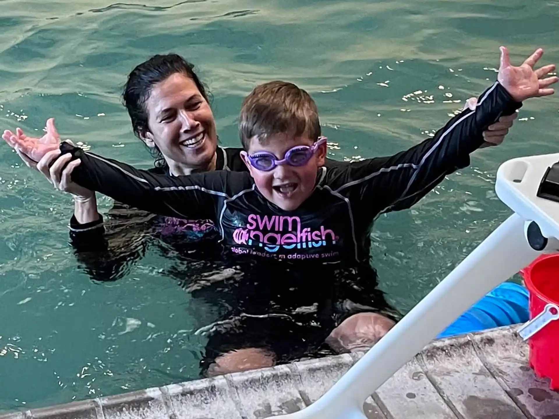 a man and a woman in a pool