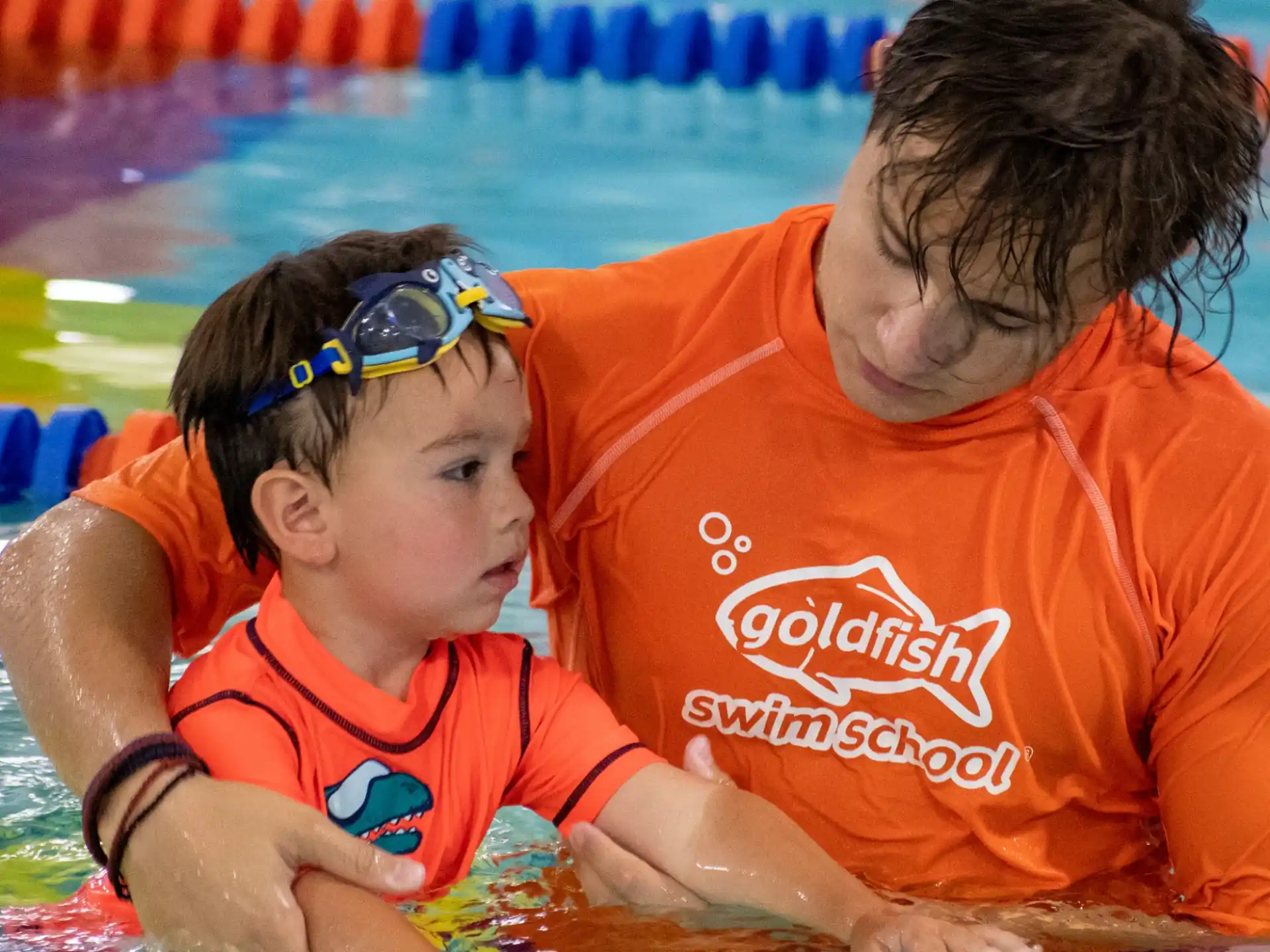 a man and a child in a pool