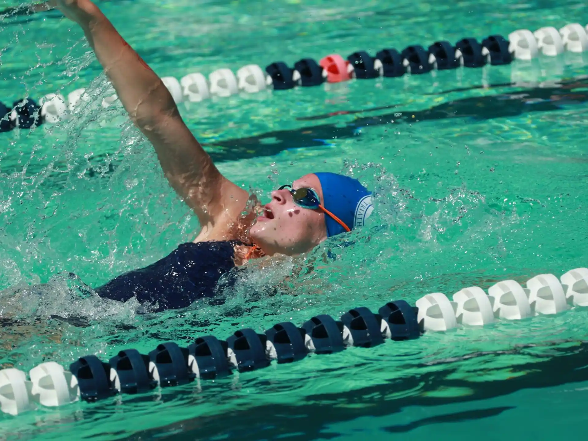 a person swimming in a pool