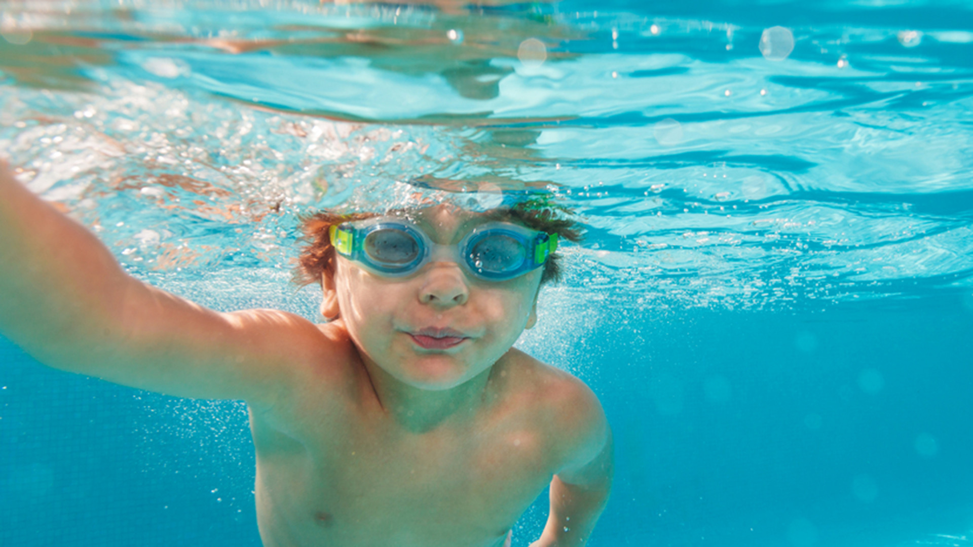 a child swimming in a pool
