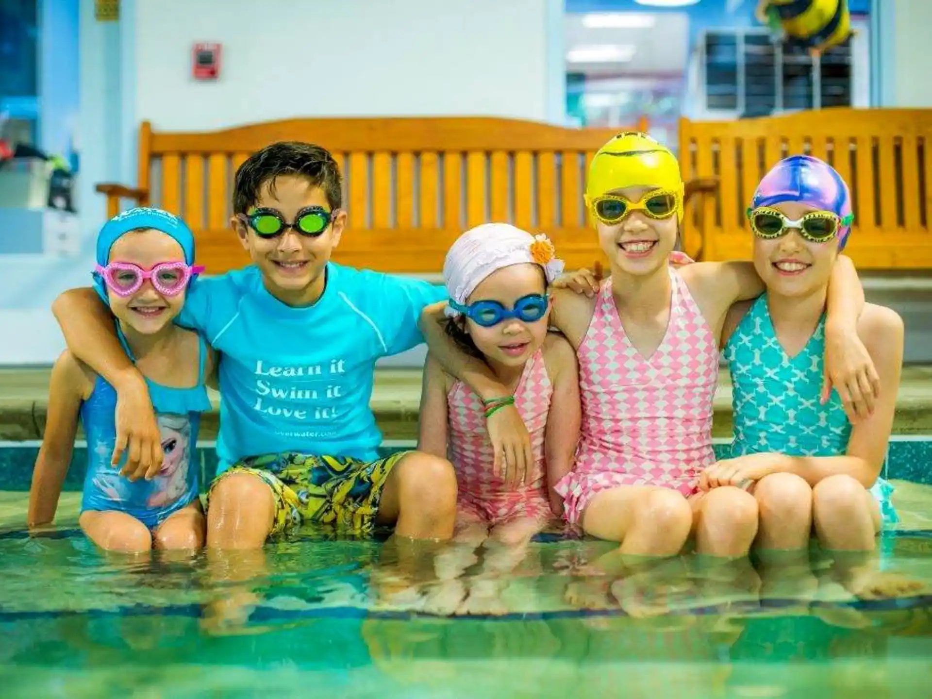 a group of kids in a pool